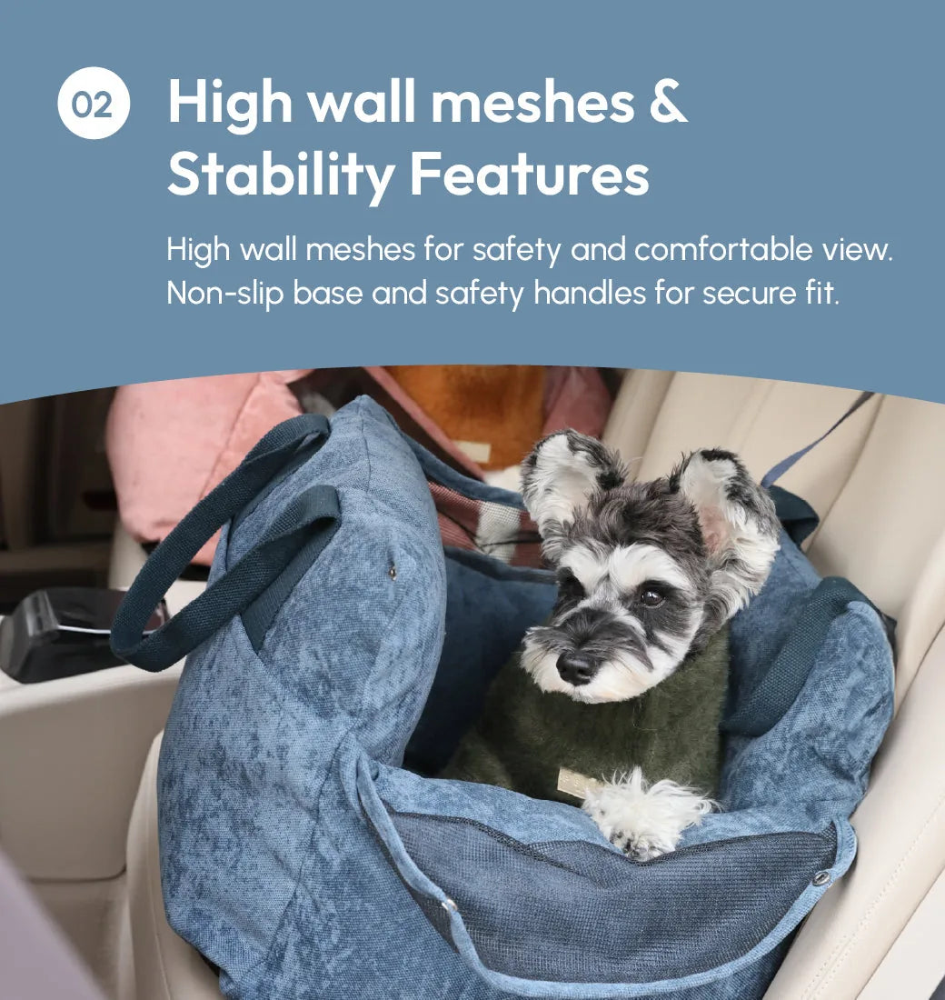 Dog comfortably seated in a blue Puff Guard car seat with high mesh walls in a vehicle interior.
