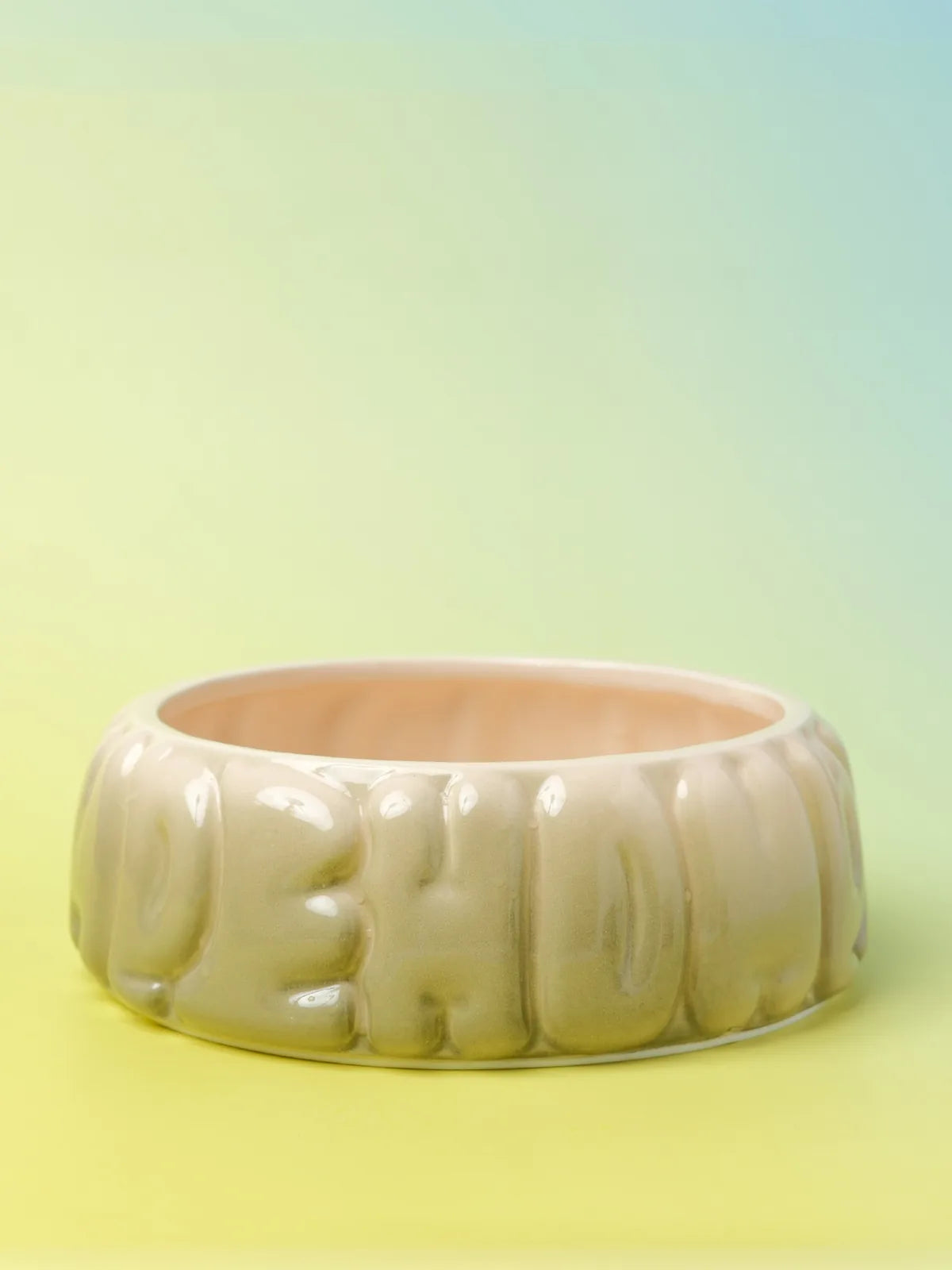 Gradient olive ceramic pet bowl with a puff logo design, featuring a smooth arc shape and spill-proof inner rim.