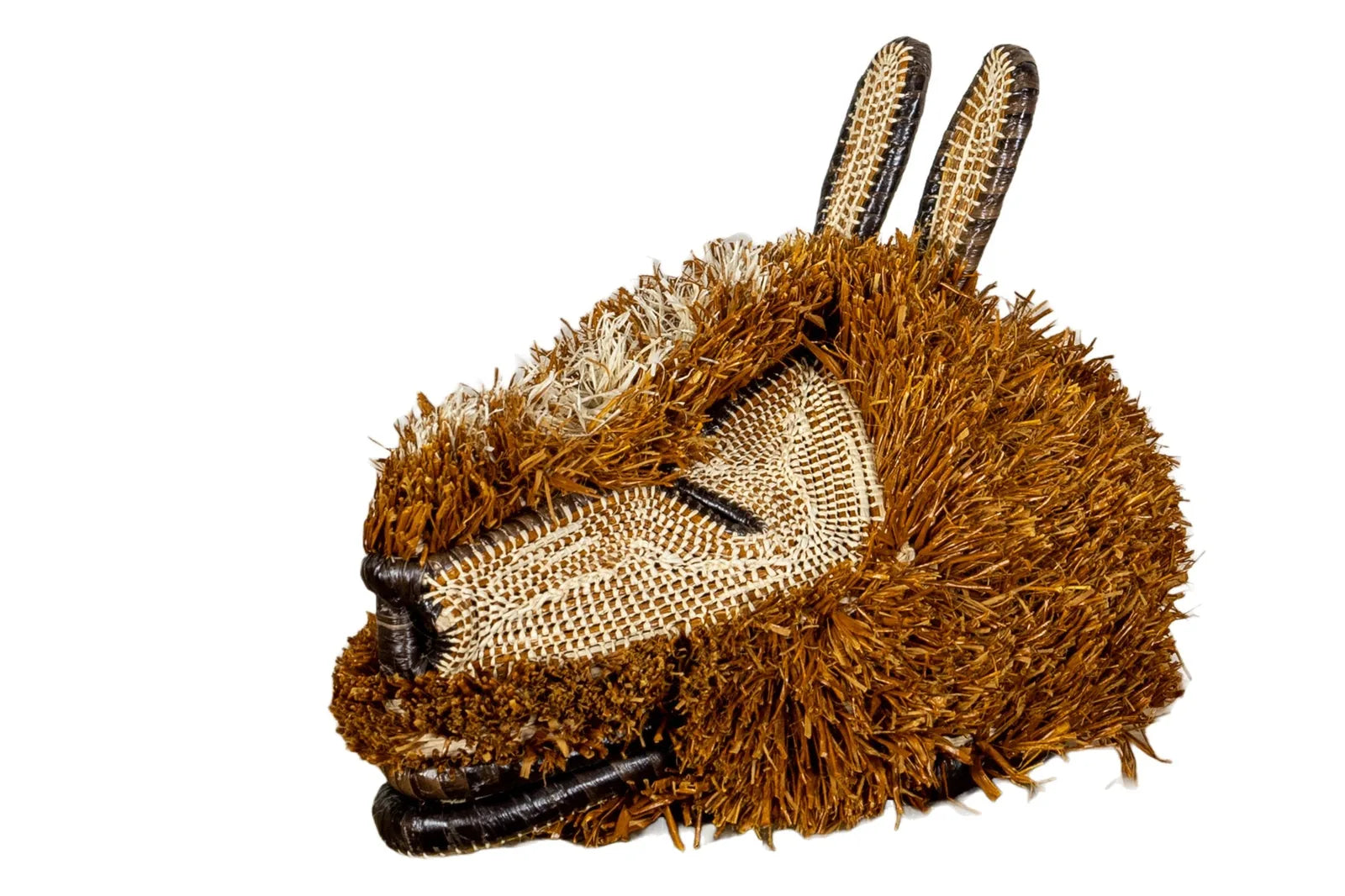 Handwoven brown Puppy Dog Mask with textured fibers, showcasing unique rainforest-inspired designs and natural dyes.