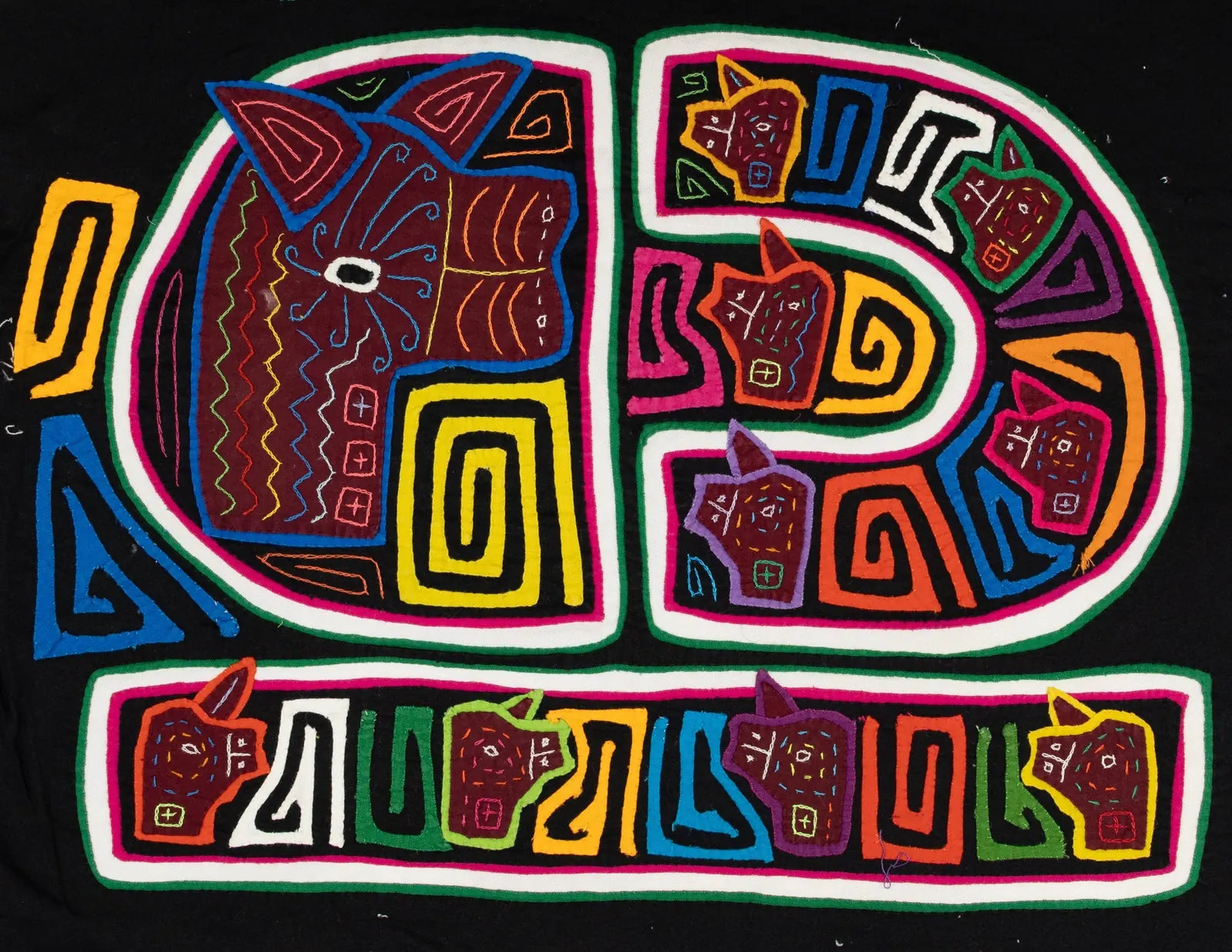 Colorful geometric designs of dogs in rich fabrics on a black background, showcasing traditional Panamanian Mola craftsman...