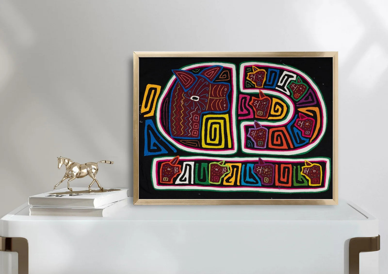 Colorful hand-stitched Mola tapestry featuring geometric dog designs on a black background. Unique Latin American textile...