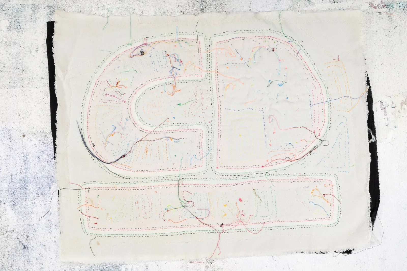 Hand-stitched Panama Mola featuring colorful geometric patterns on cream fabric, showcasing vibrant threadwork.