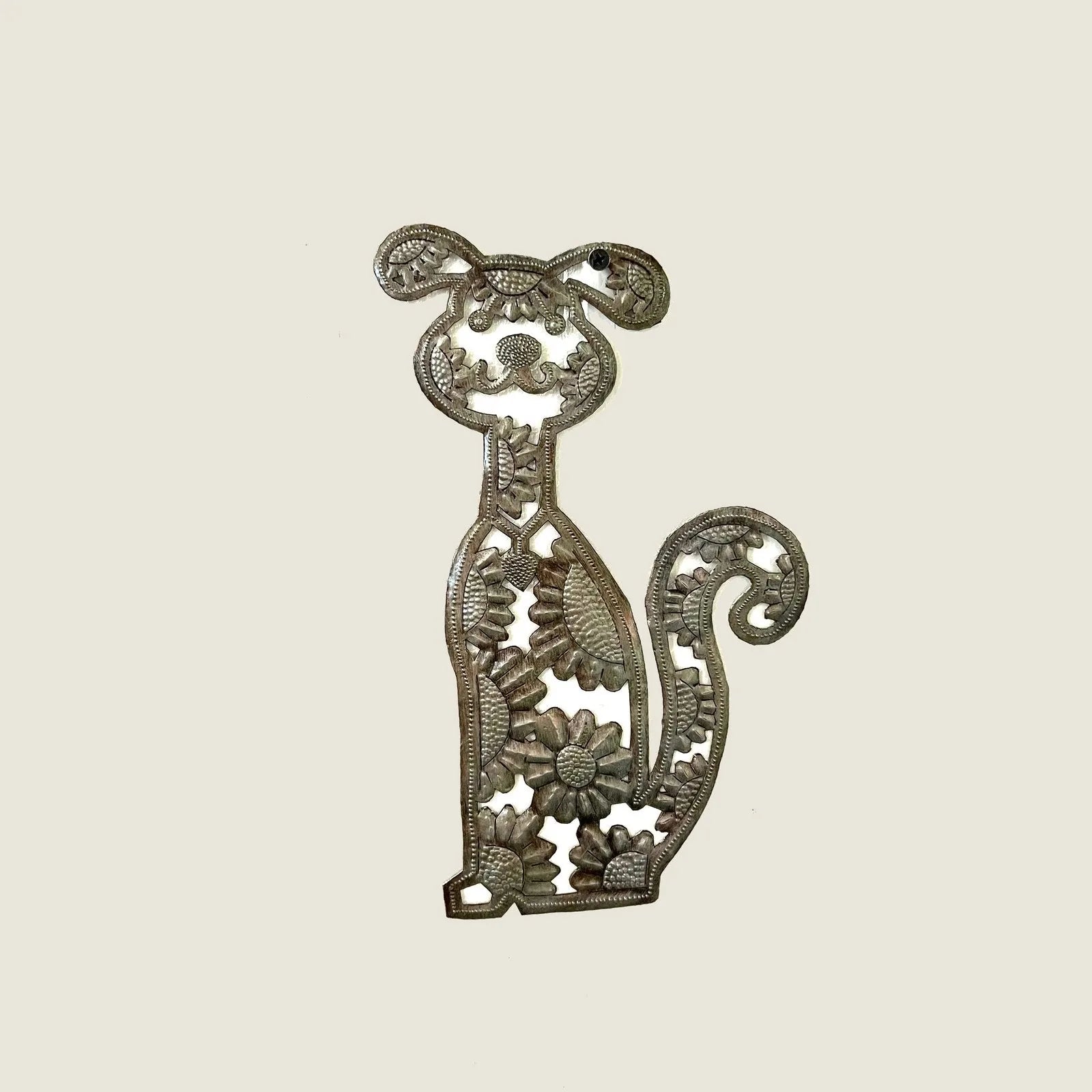Handcrafted metal art sculpture of a puppy with floral details, made from recycled steel. Perfect for dog decor.