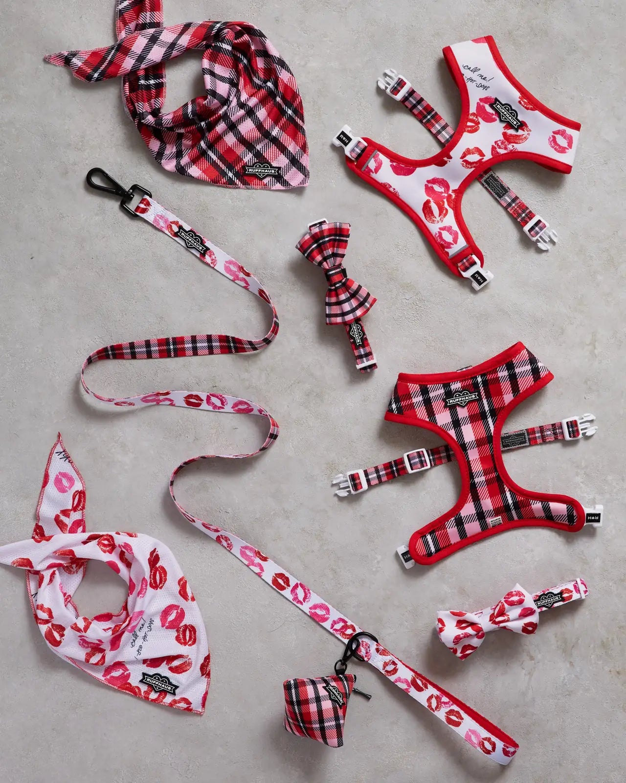 Red and pink plaid dog collar with detachable bowtie and matching accessories, featuring playful lip print accents.