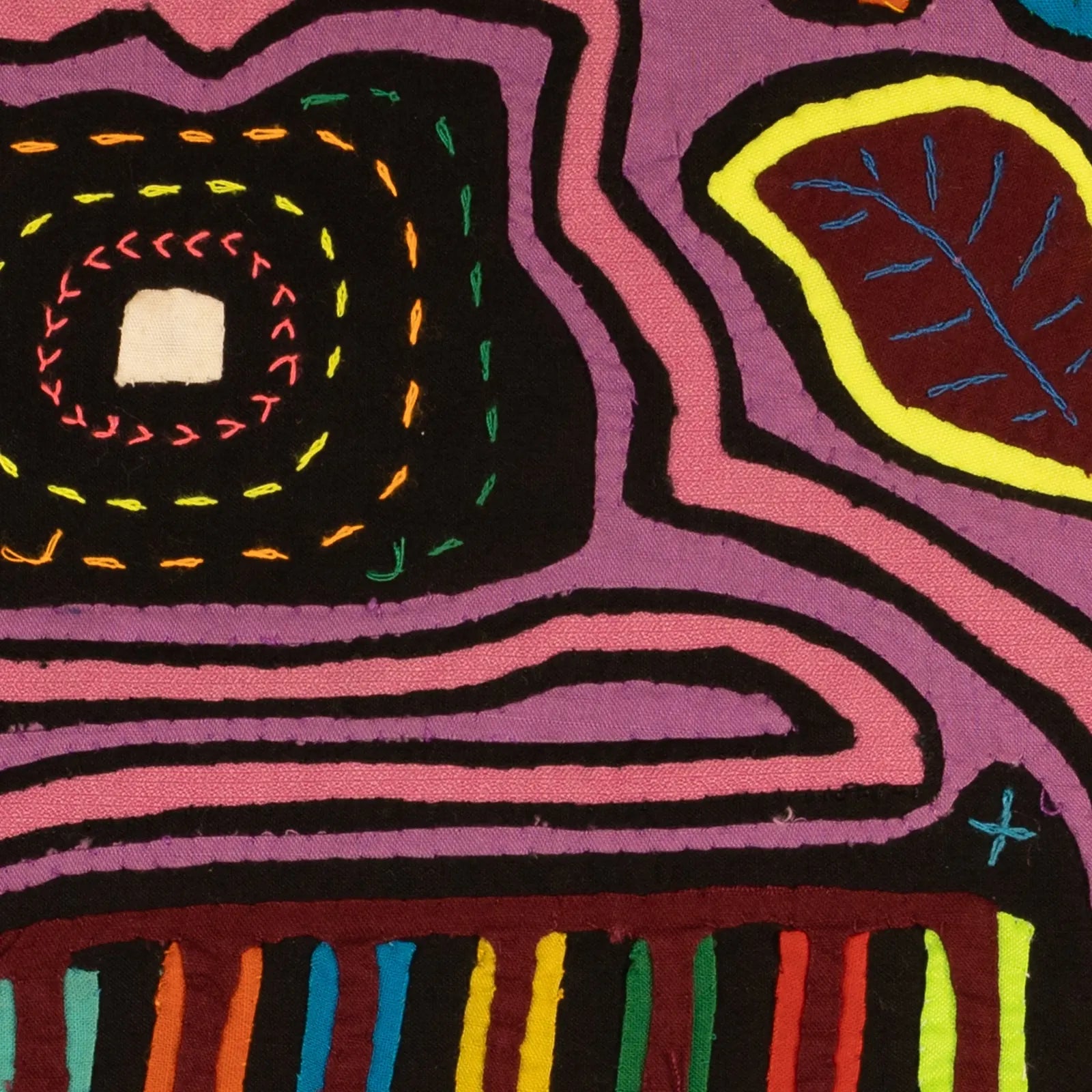 Colorful hand-stitched Mola featuring a purple and black abstract design with geometric patterns and vibrant thread details.