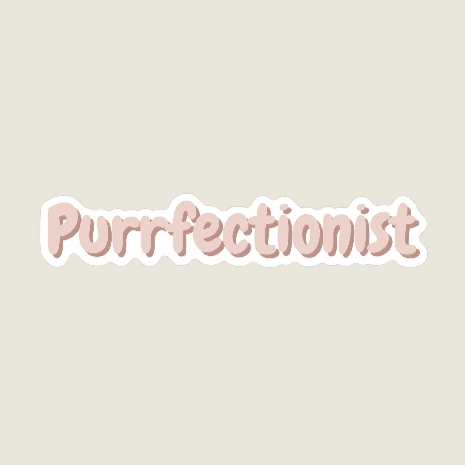 Matte, pastel pink "Purrfectionist" sticker with a playful font on a light beige background.