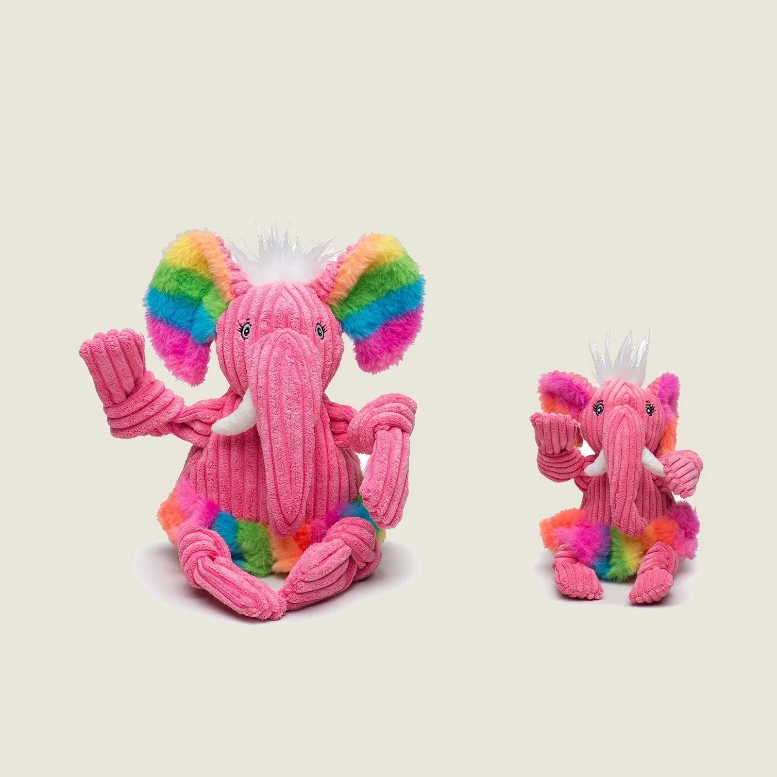 Pink Rainbow Elephant Knottie® plush dog toy with colorful fur and knotted limbs, available in small and large sizes.