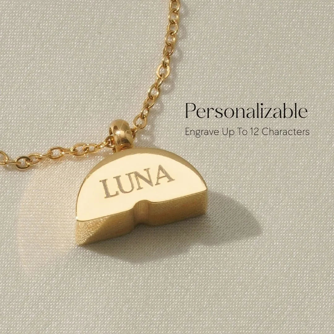 Gold memorial necklace with a colorful pendant, engraved "LUNA," symbolizing connection and remembrance.