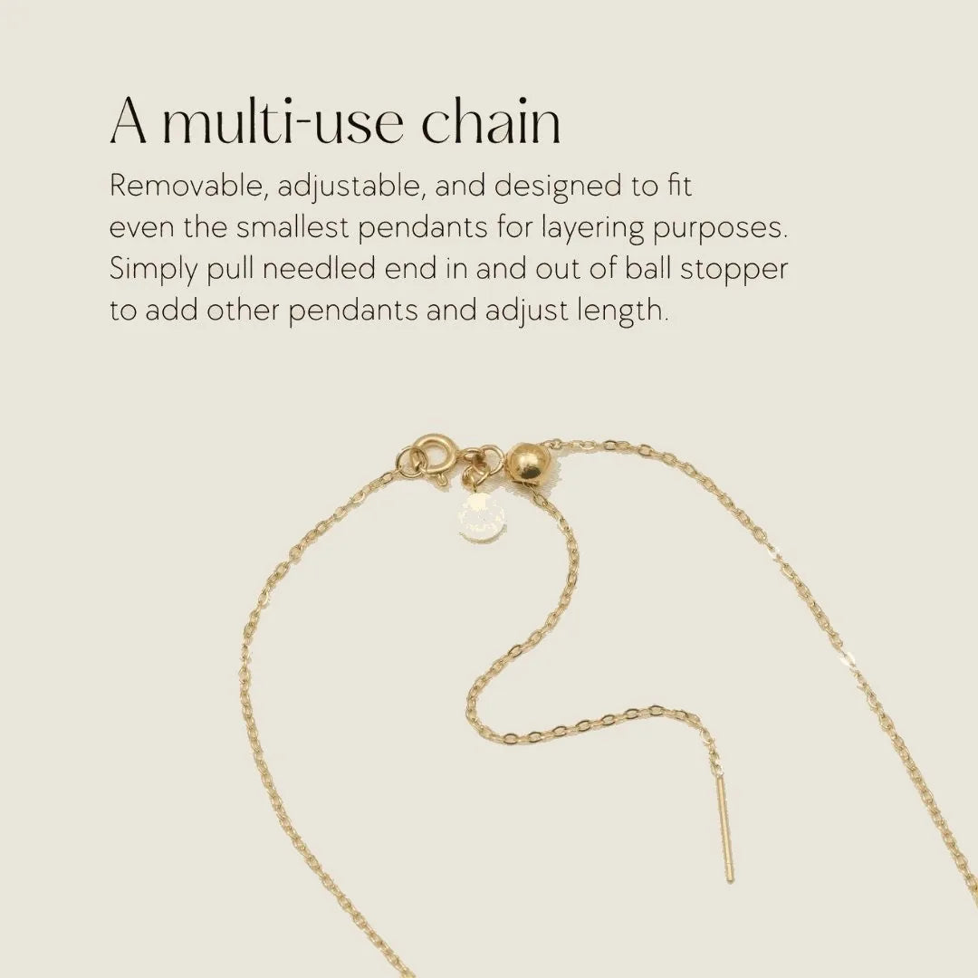 Gold adjustable chain with a ball stopper, designed for layering pendants in memorial jewelry.