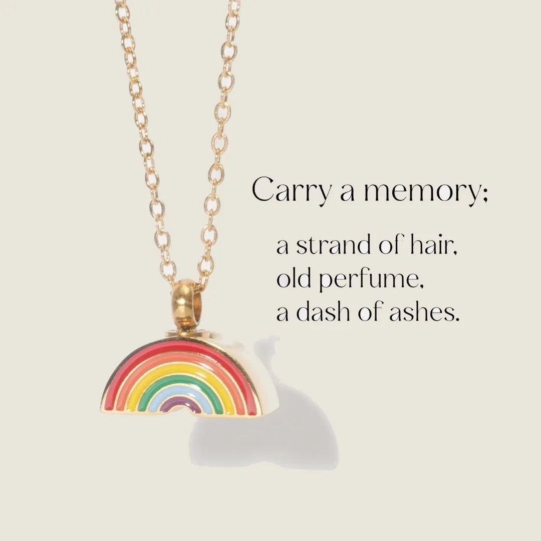 Rainbow memorial necklace featuring a colorful rainbow design, hung from a delicate gold chain.
