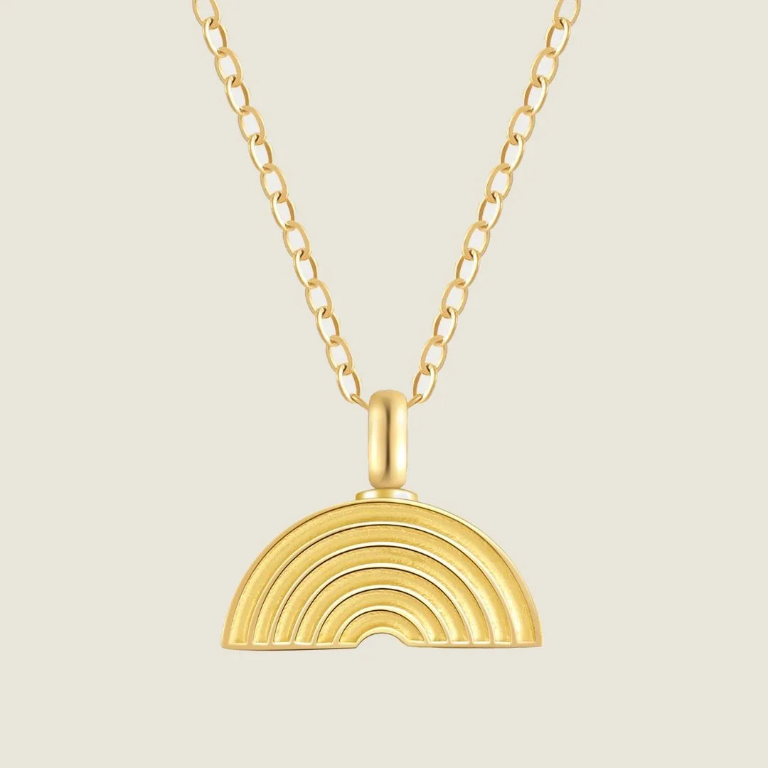 Gold memorial necklace with a rainbow pendant, featuring layered design and a delicate chain.