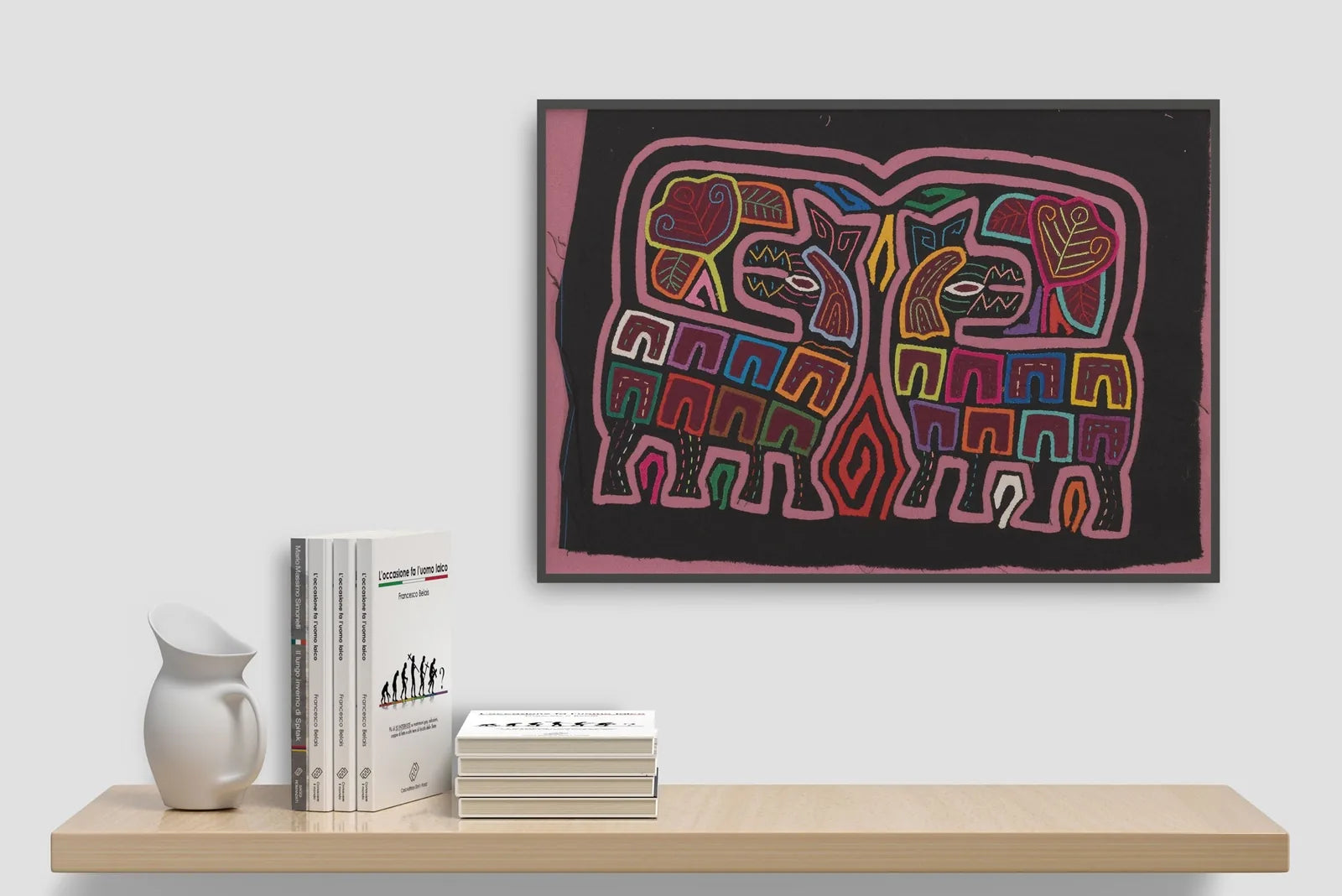 Colorful geometric patterns of elephants on a black background, showcasing hand-stitched textile art by TraderBrock.