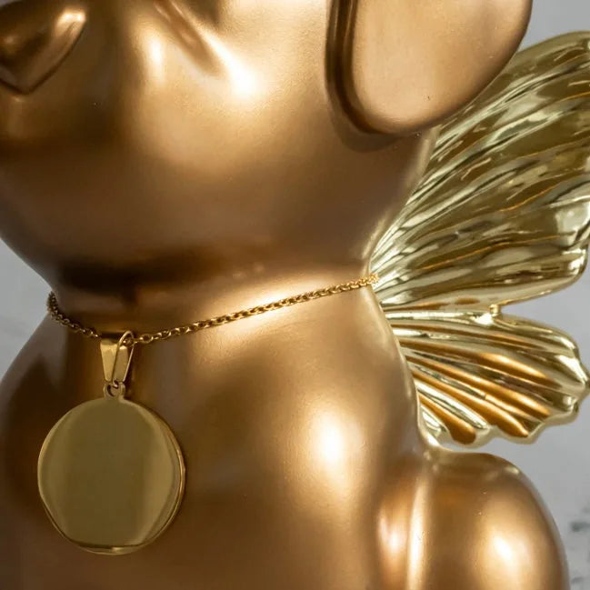 Golden Retriever Angel Dog Urn features elegant gold wings and a round pendant, perfect for memorial display.