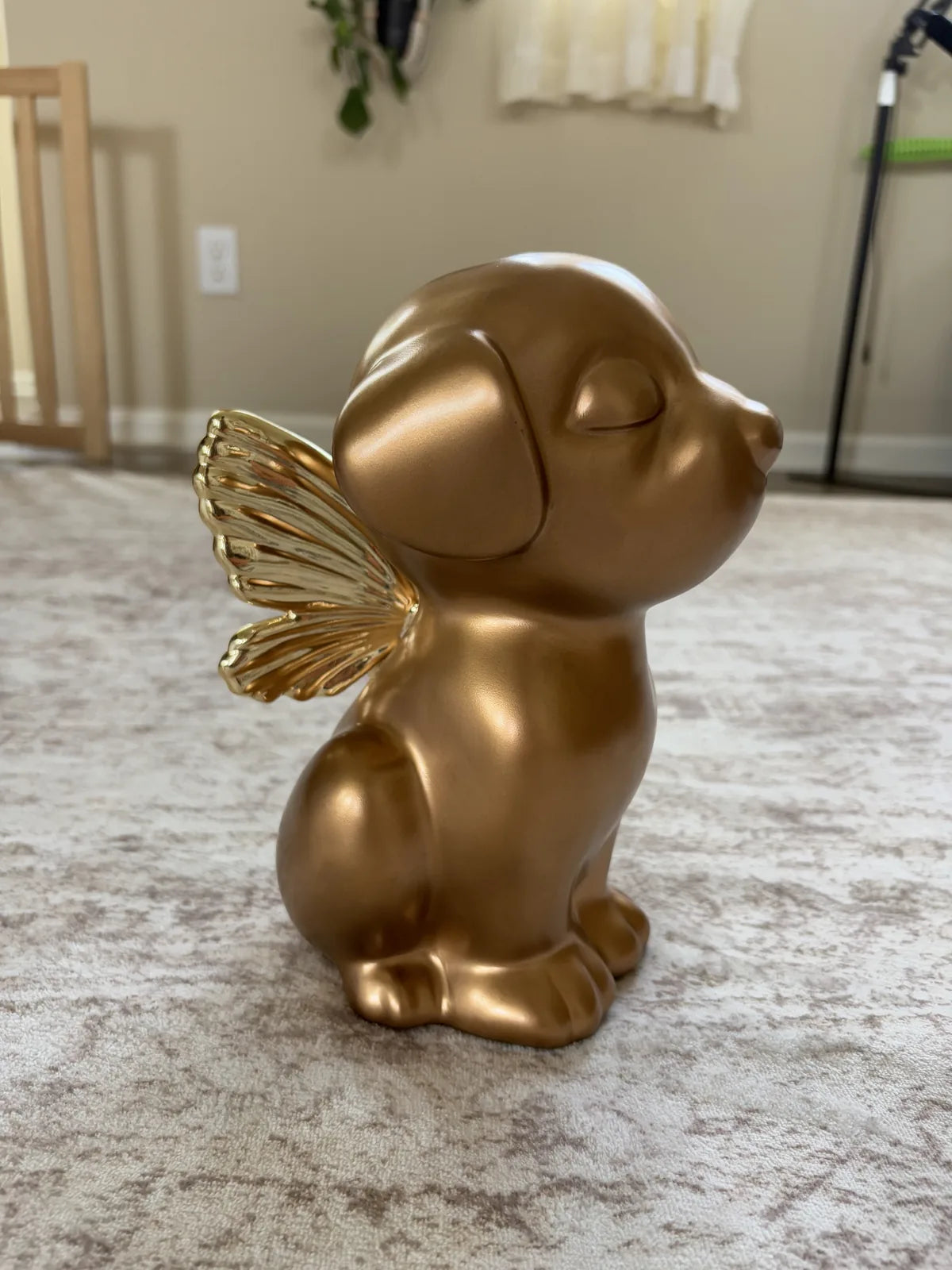 Handcrafted gold Retriever angel dog urn featuring serene closed eyes and delicate wings, measuring 9 inches tall.