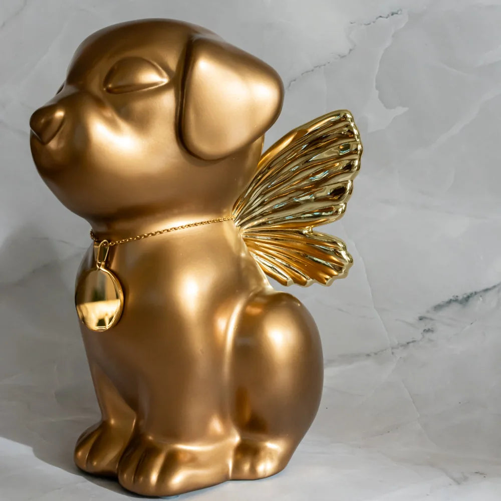 Retriever Angel Dog Urn in gold, featuring detailed wings and a reflective tag, symbolizing a loving pet memorial.