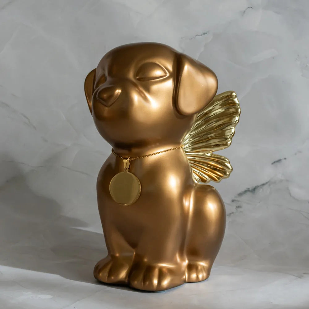Handcrafted gold Retriever angel dog urn with wings, featuring a tag, ideal for pet memorials.