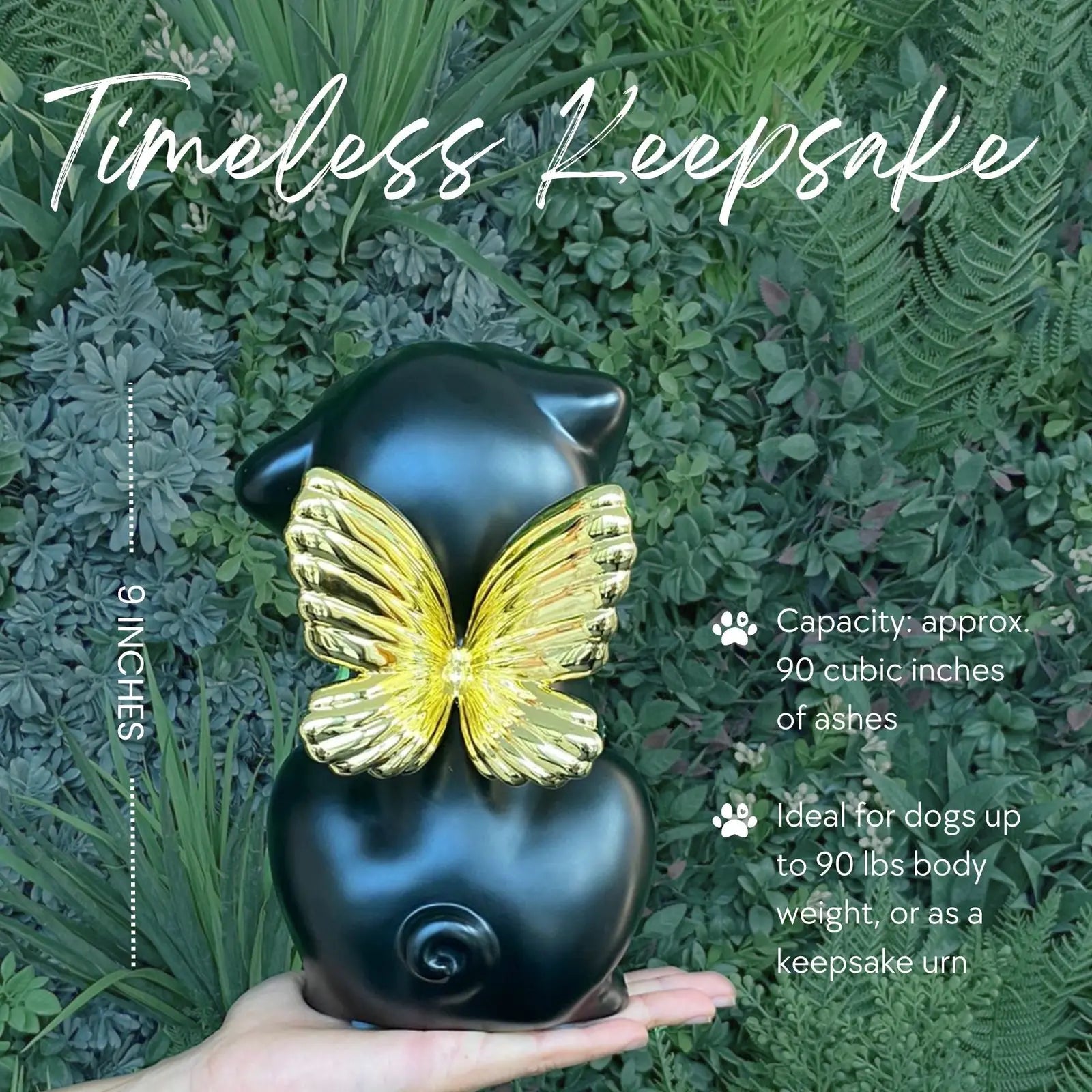 Handcrafted black Retriever angel urn with gold wings, about 9 inches tall, set against green foliage for a serene tribute.