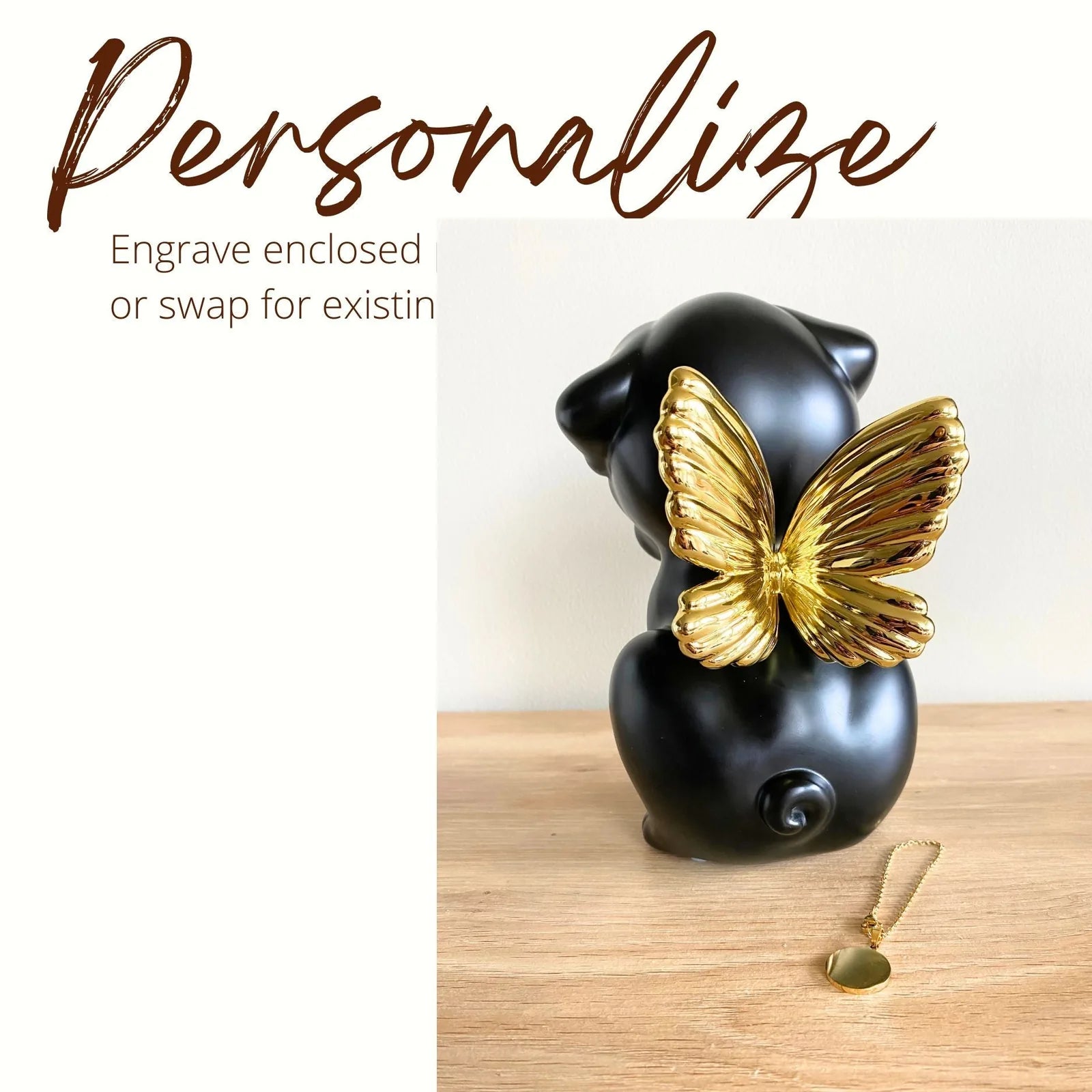Handcrafted black Retriever urn with gold wings, designed for pet memorials. Includes a gold pendant for personalization.