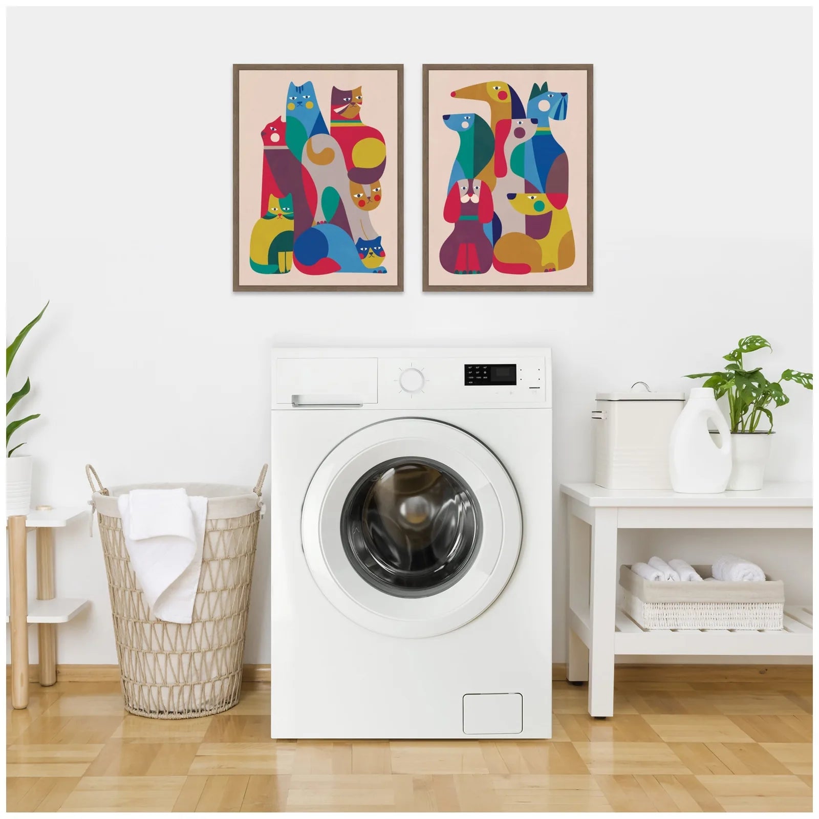 Framed colorful retro cat and dog artwork displayed above a white washing machine in a modern home setting.