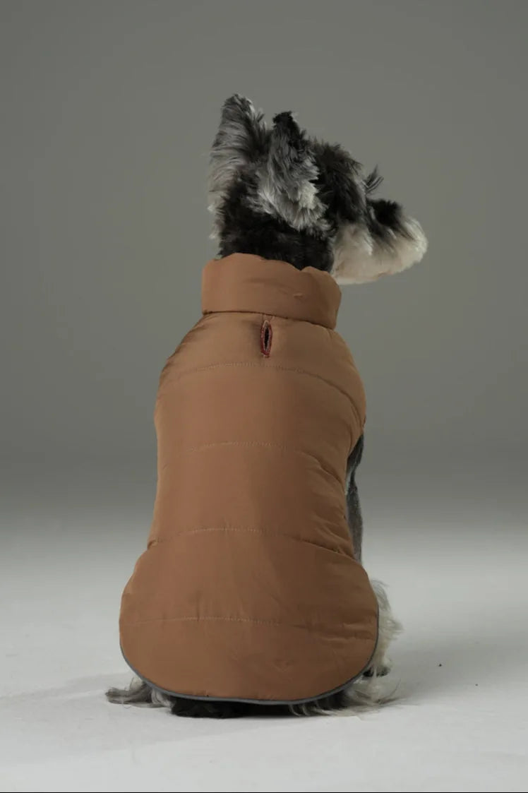 Reversible dog vest jacket in warm brown, featuring a high collar and snug fit, ideal for outdoor comfort.