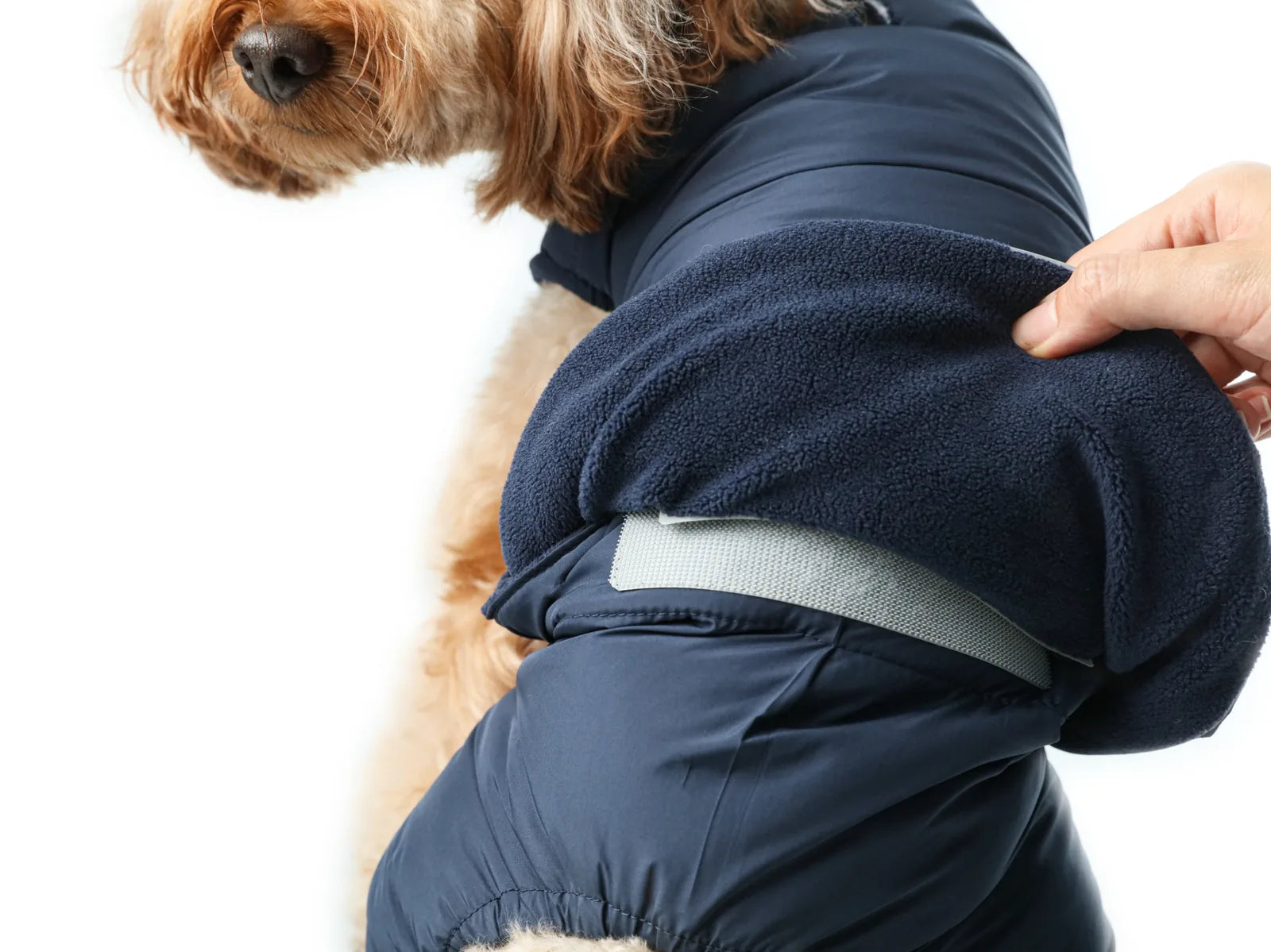 Reversible red dog vest jacket showcasing thick polar fleece lining and adjustable Velcro closures for a snug fit.
