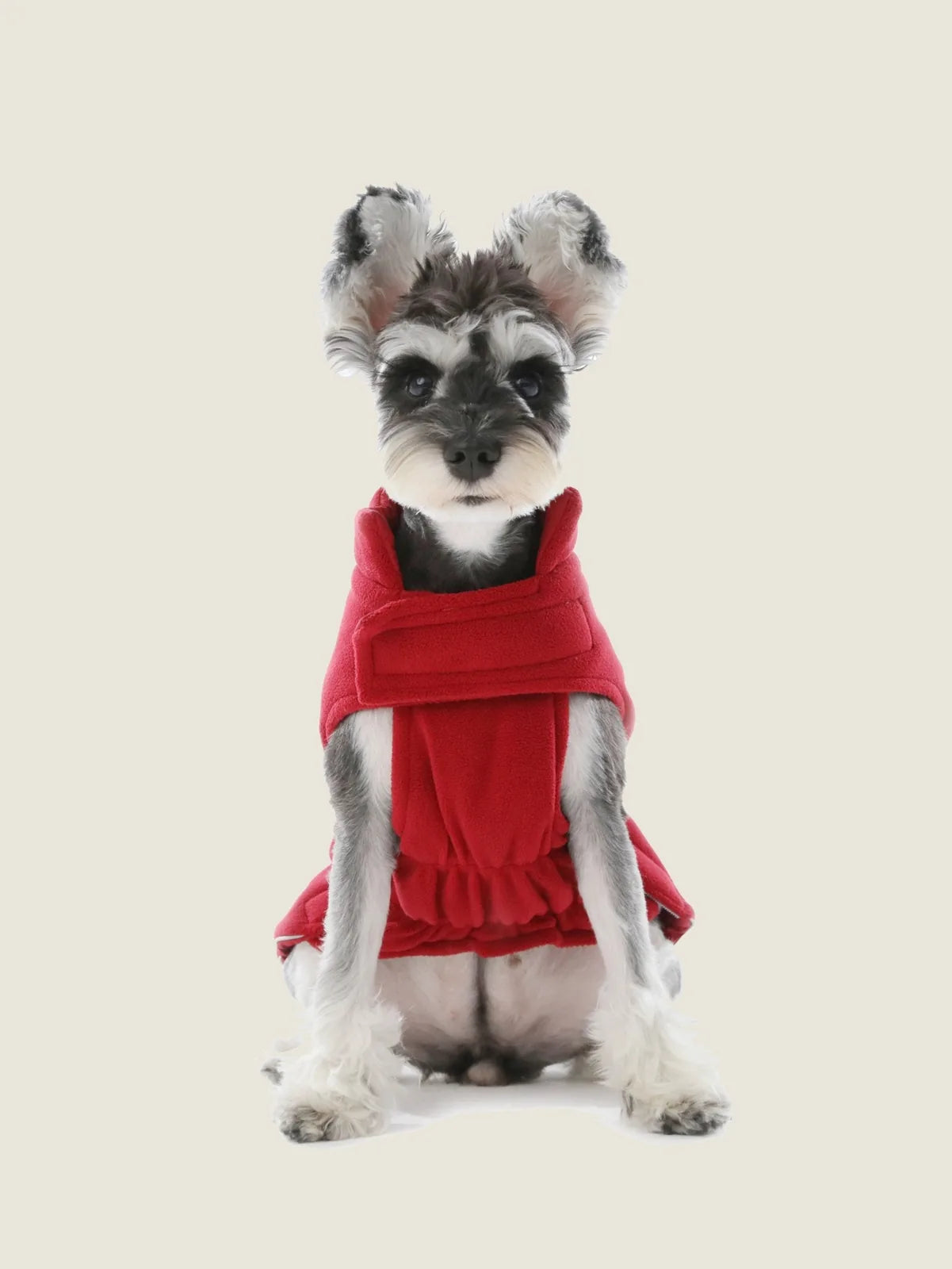 Reversible red dog vest jacket made of soft fleece, featuring adjustable straps for a snug fit and reflective details.