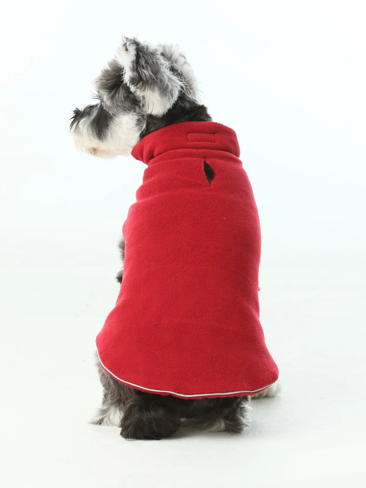 Reversible red dog vest jacket made of thick polar fleece, featuring a secure leash hole and adjustable fit.