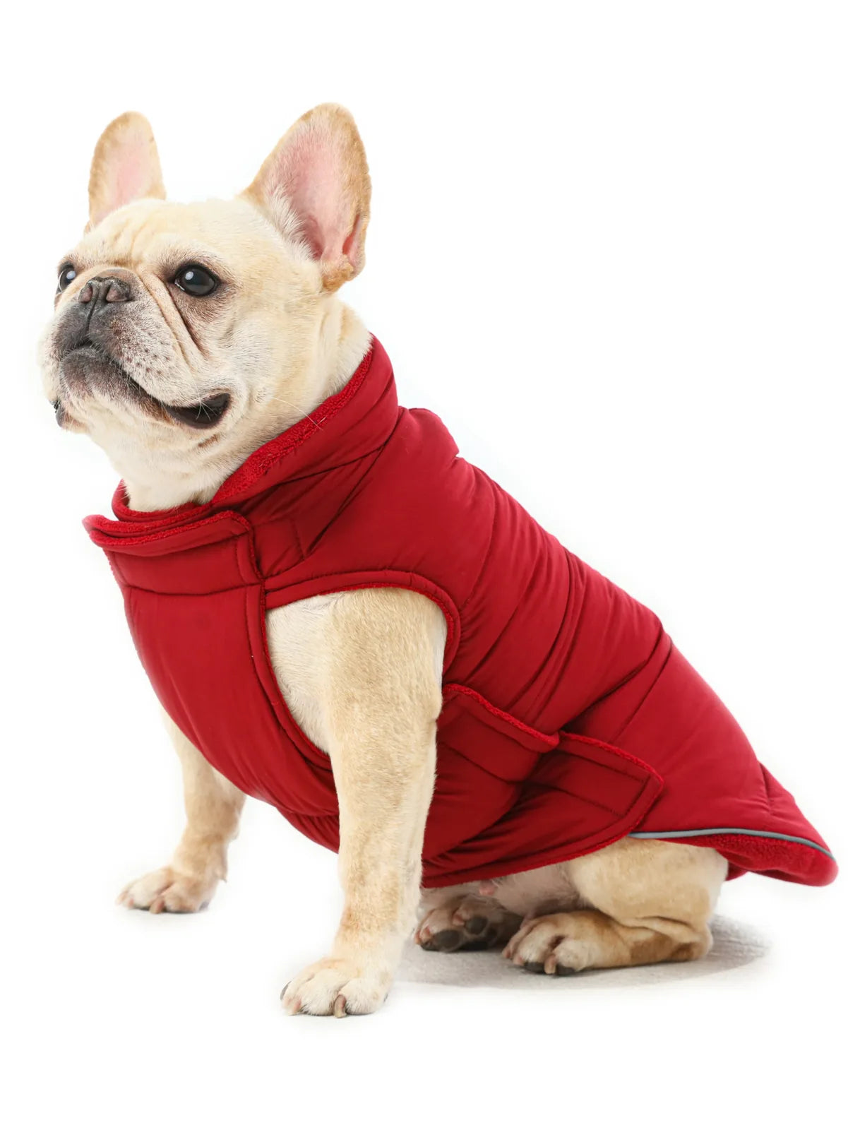 Reversible red dog vest jacket with thick fleece lining, ideal for cold weather, featuring adjustable Velcro closures.