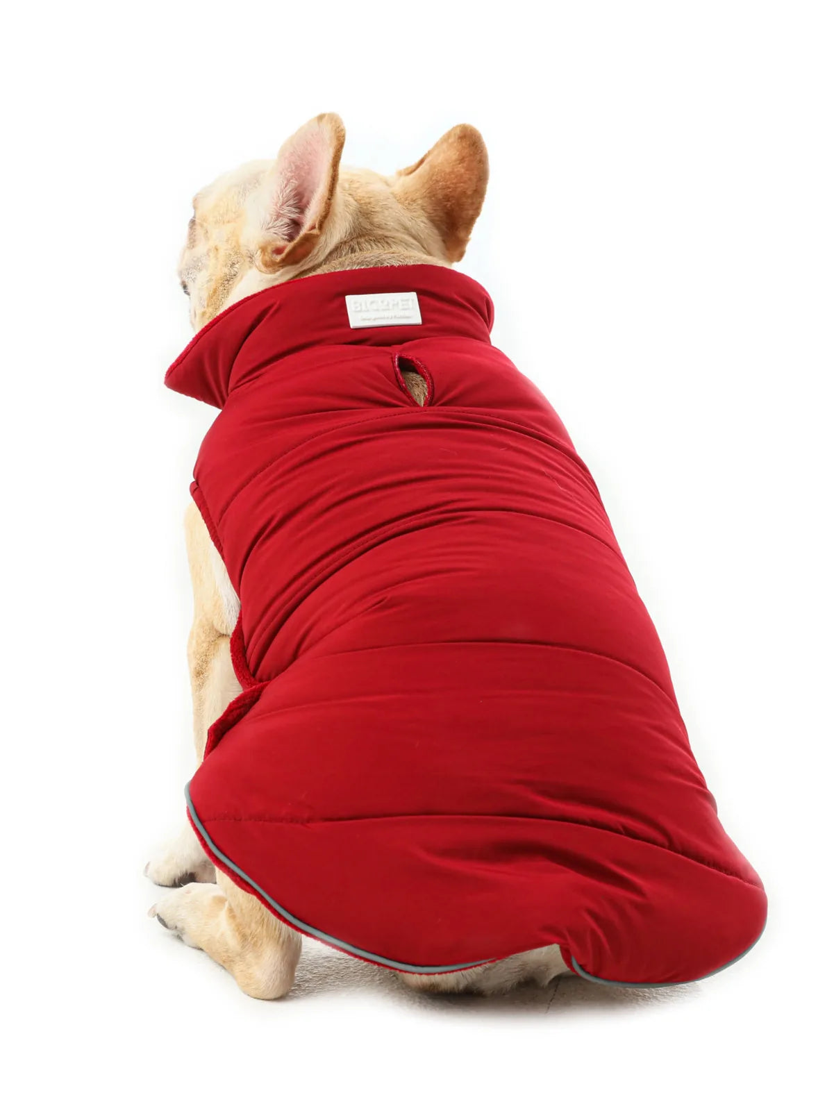 Reversible dog vest jacket in red, featuring a high collar and reflective details, perfect for cold and rainy days.
