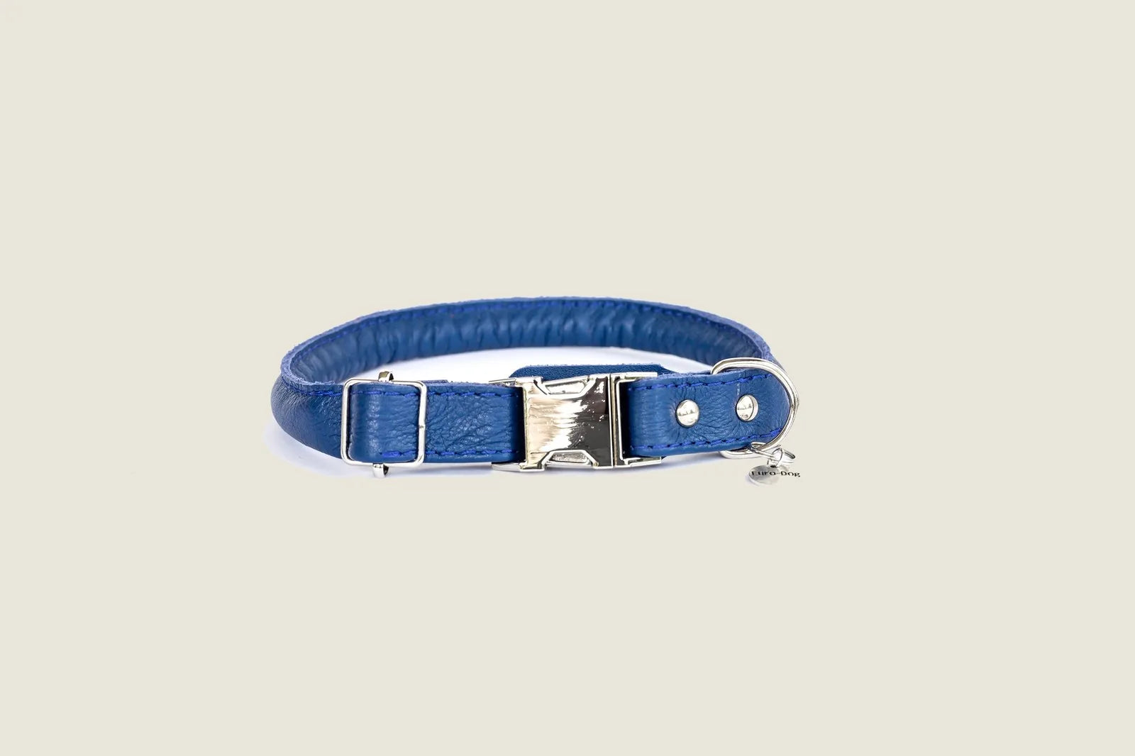 Rolled blue leather dog collar with a quick-release buckle and silver accents, designed for comfort and durability.