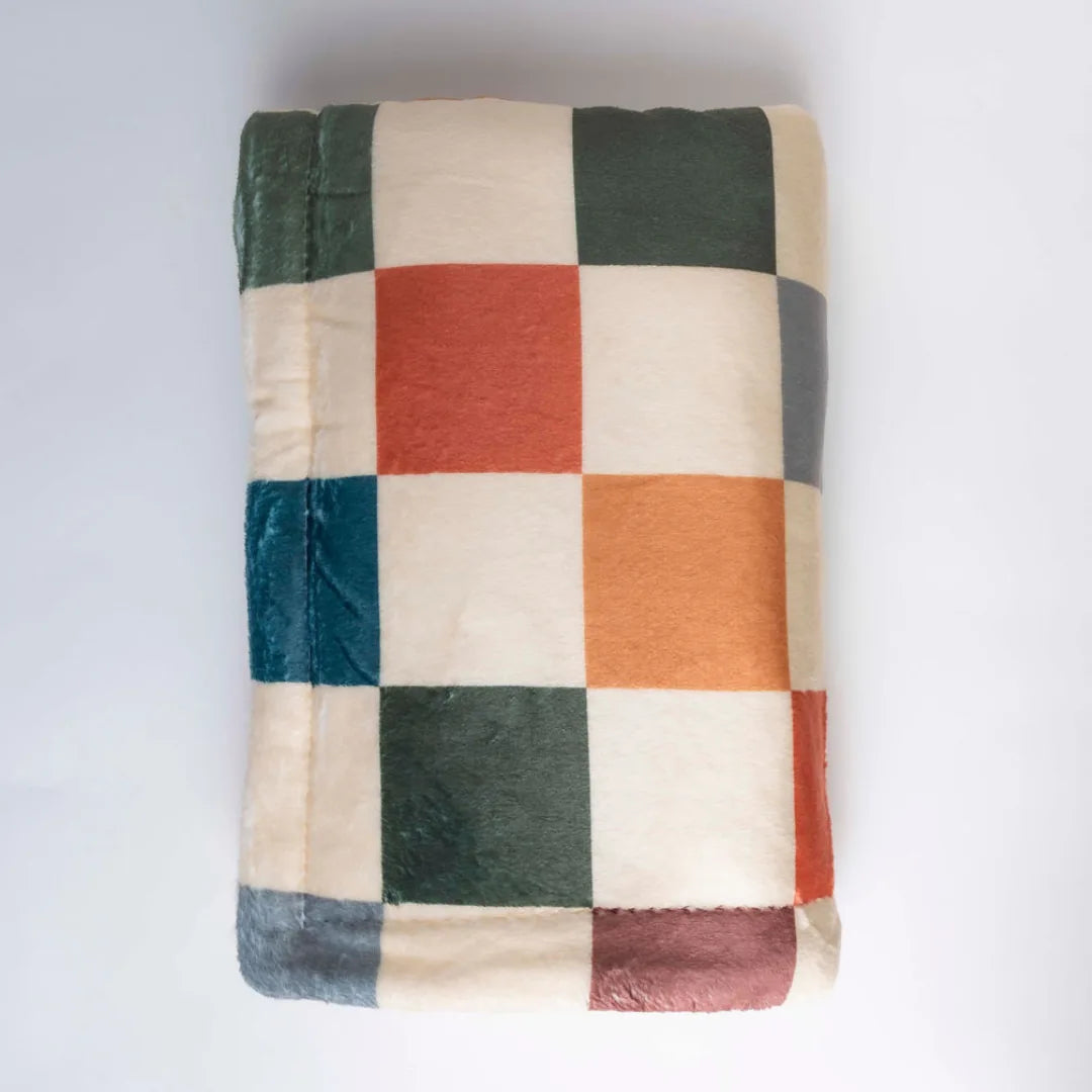 Sage & Cider Dog Blanket features a cozy checkerboard pattern in earthy tones, made of soft micro-fiber and cream sherpa.