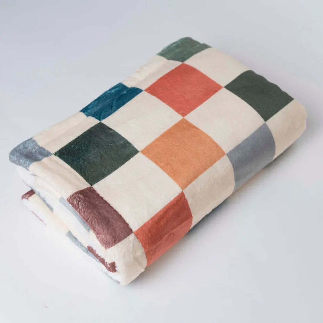 Cozy Sage & Cider dog blanket featuring a colorful plaid design in soft microfiber and sherpa textures.