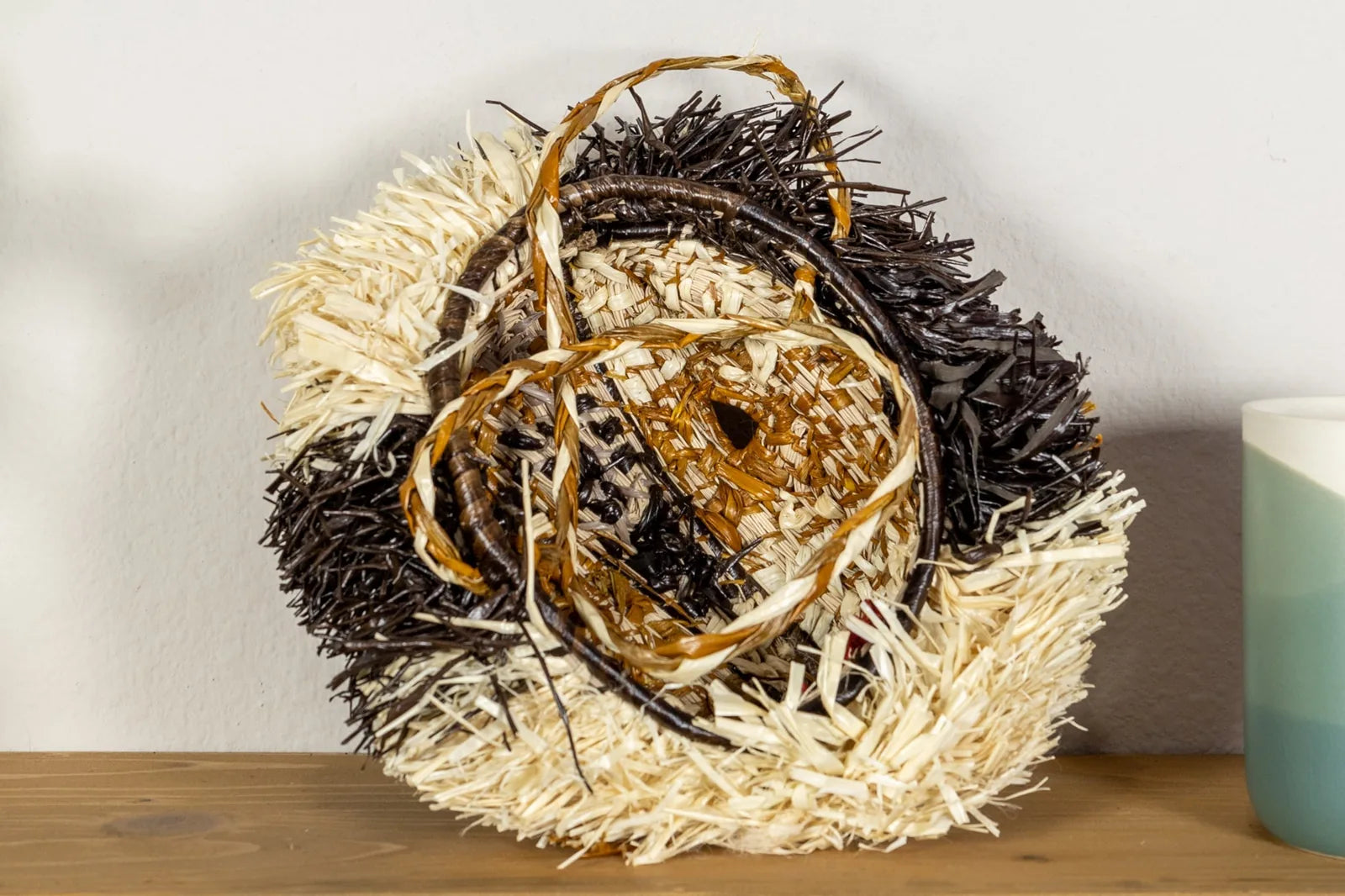 Handwoven Saint Bernard dog mask with vibrant colors and unique patterns, crafted from natural materials by Indigenous art...