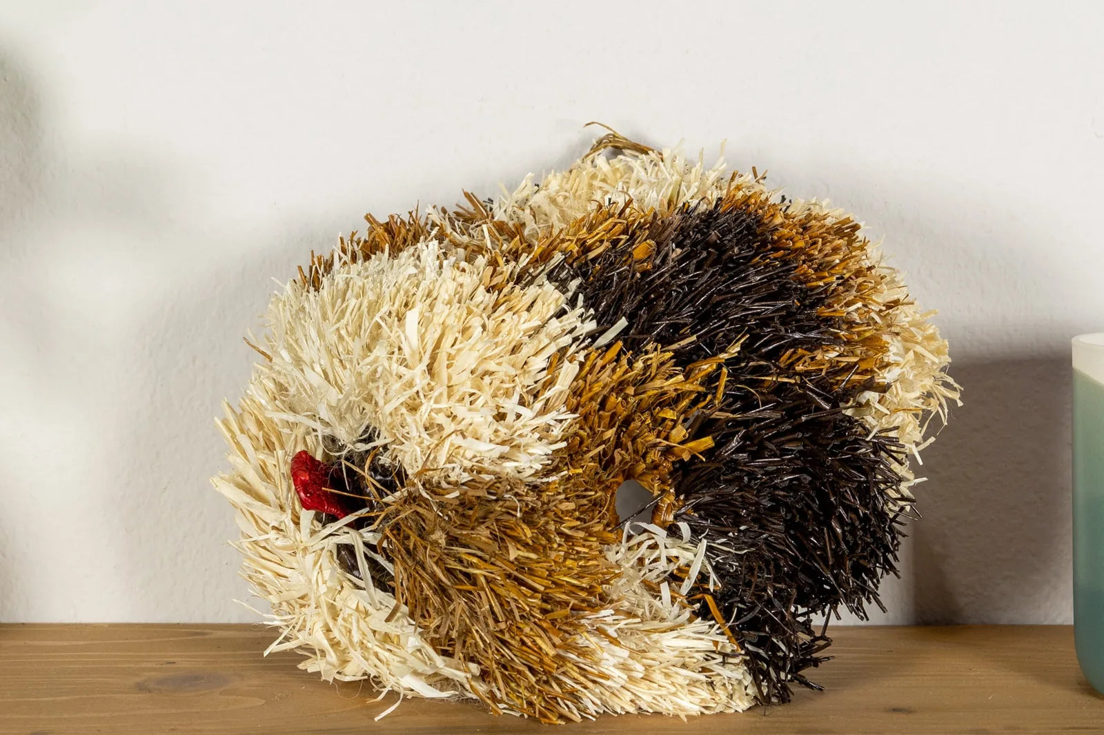 Handwoven Saint Bernard dog mask in earthy tones of brown, cream, and black, crafted by Indigenous artisans in Panama.