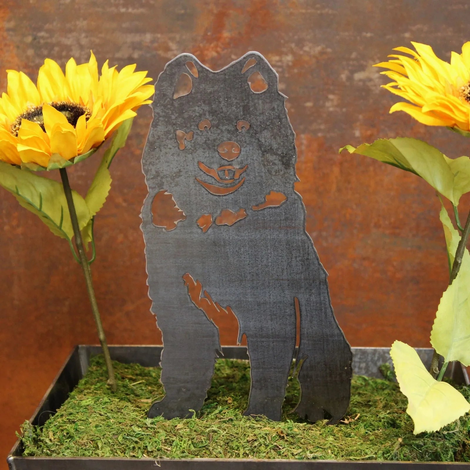 Samoyed metal silhouette in black with colorful sunflowers, showcasing outdoor dog decor craftsmanship.