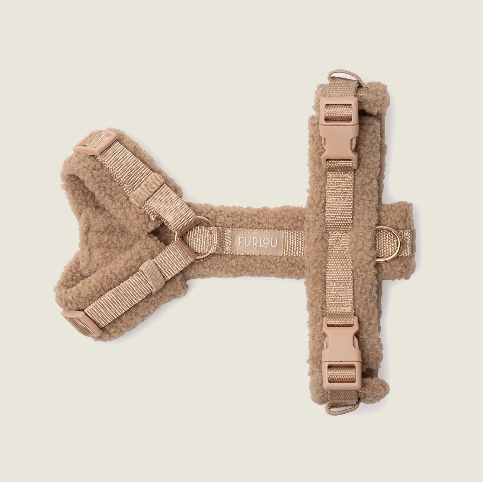 Light tan sherpa dog harness by FURLOU, featuring adjustable straps and subtle gold details for added style.