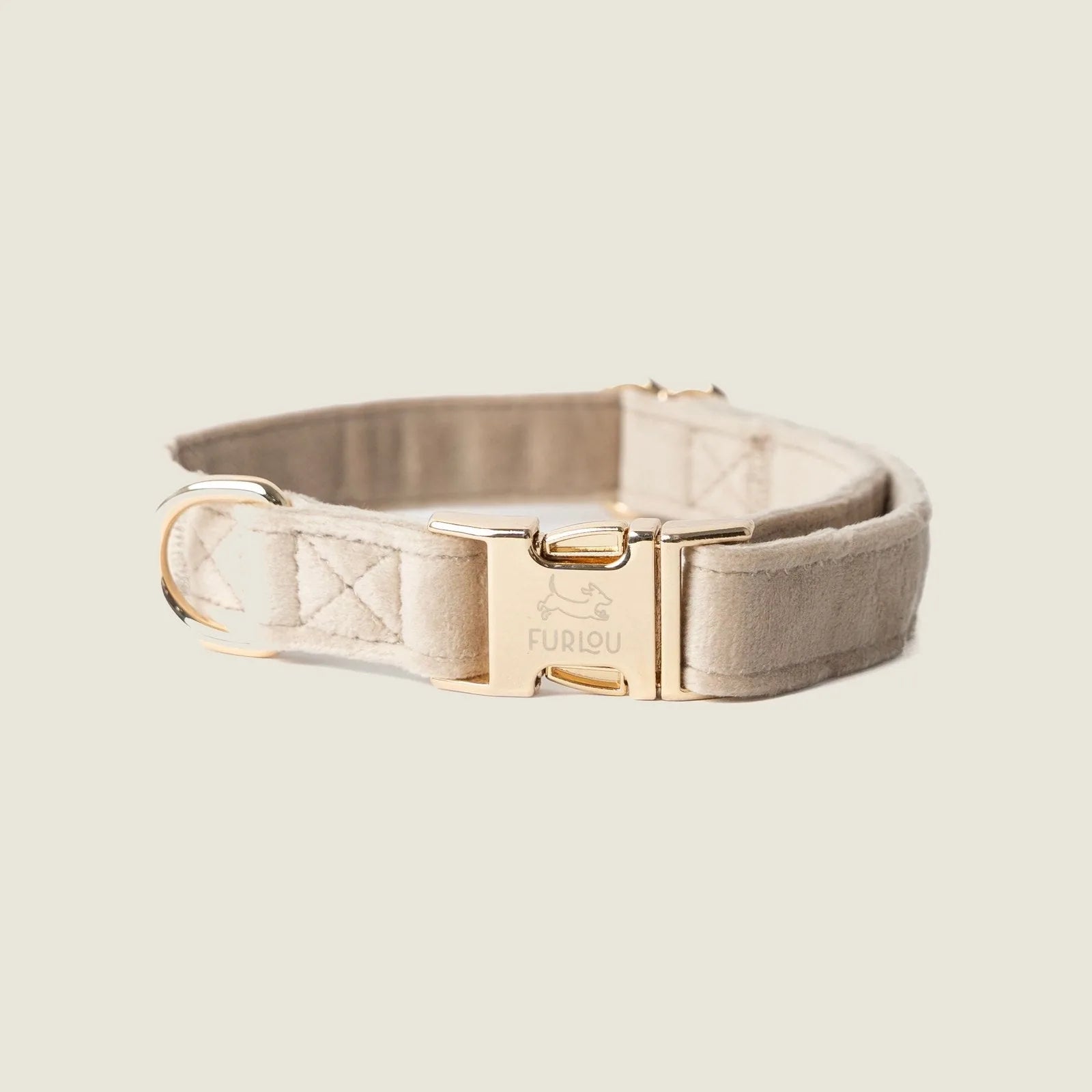 Soft velvet dog collar in sand color with gold hardware, showcasing an elegant and stylish design by FURLOU.