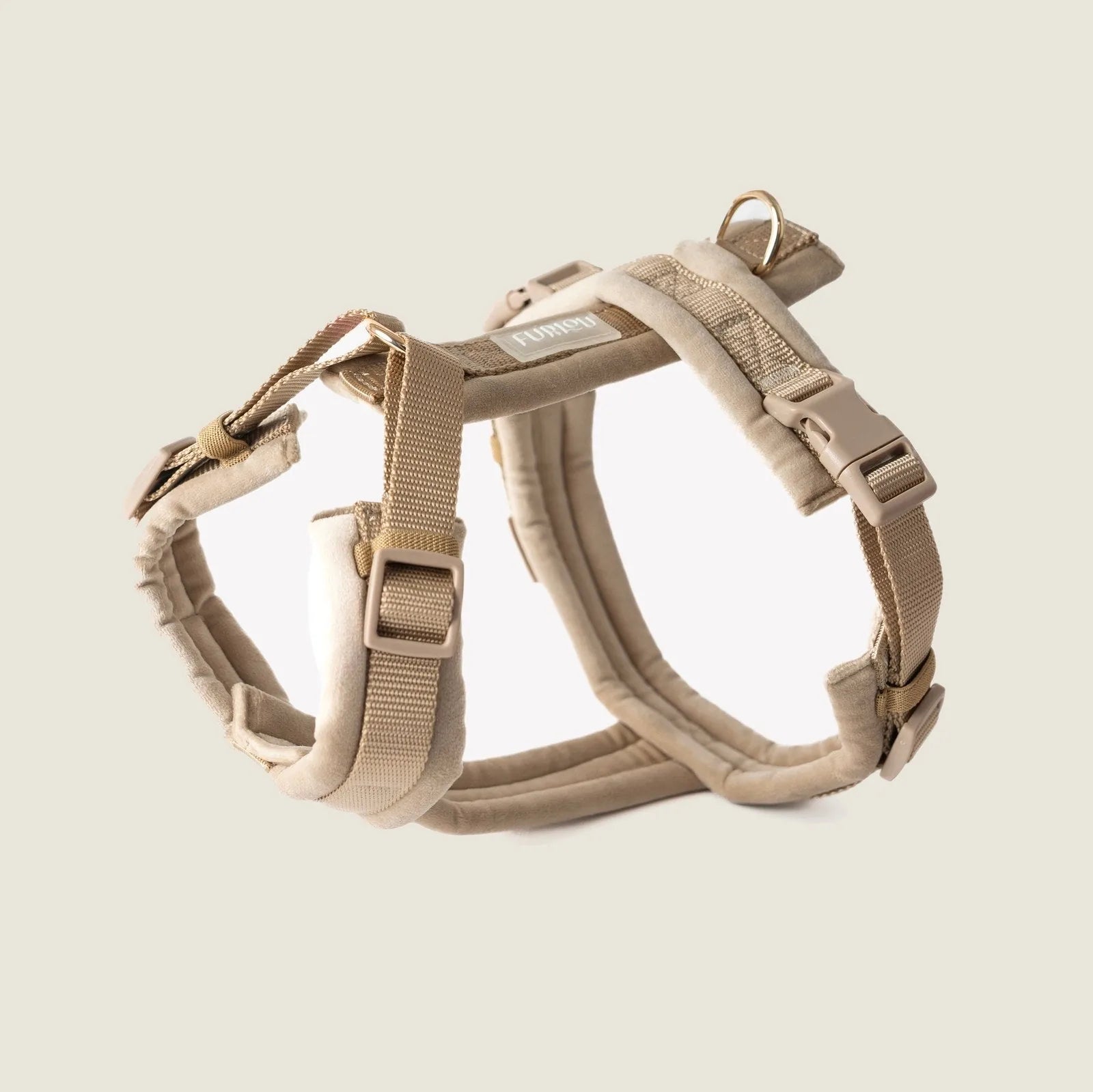 Plush beige velvet dog harness with adjustable straps and gold hardware for comfortable everyday use.