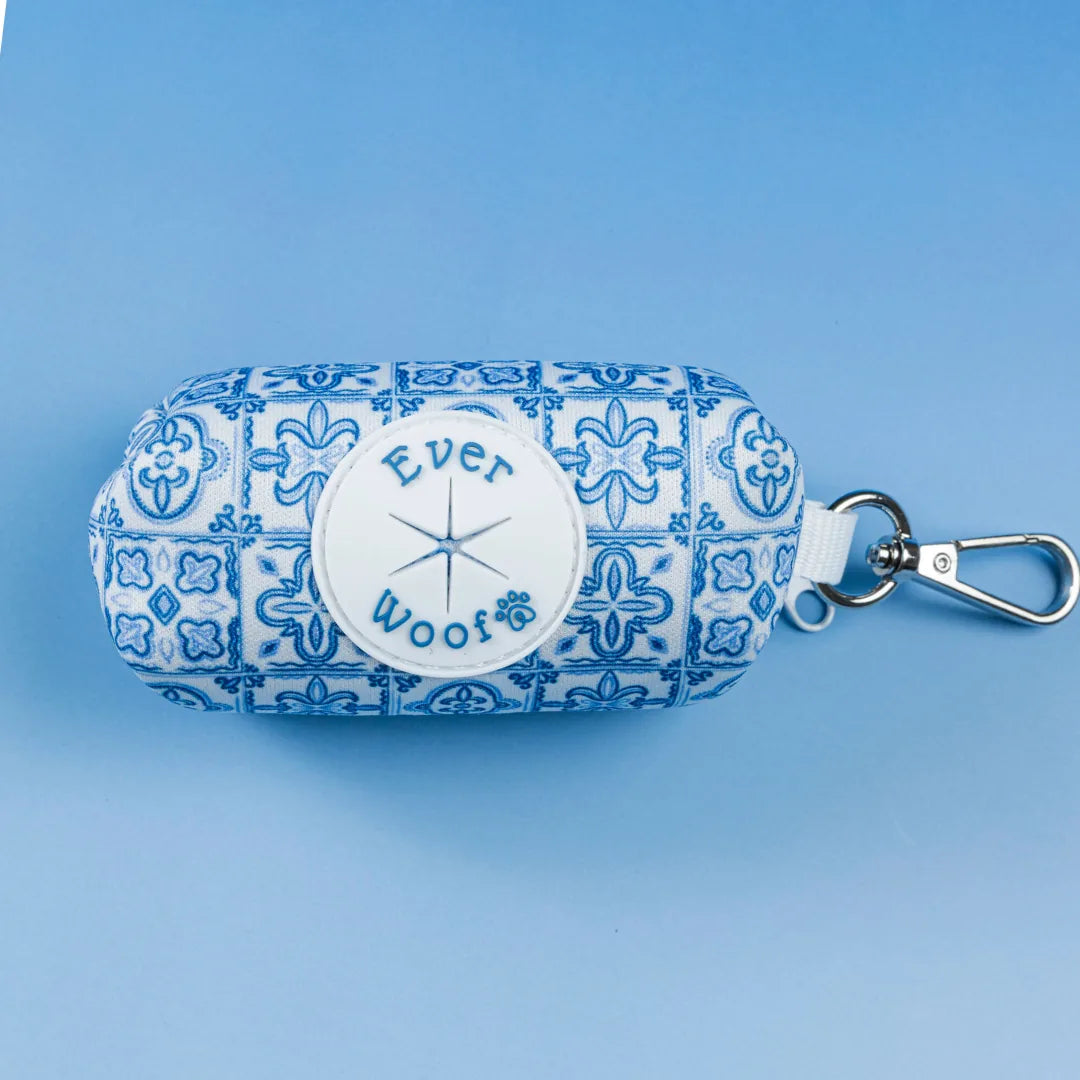 Blue and white patterned waste bag holder with an EverWoof logo, featuring a zinc alloy clip for easy attachment.