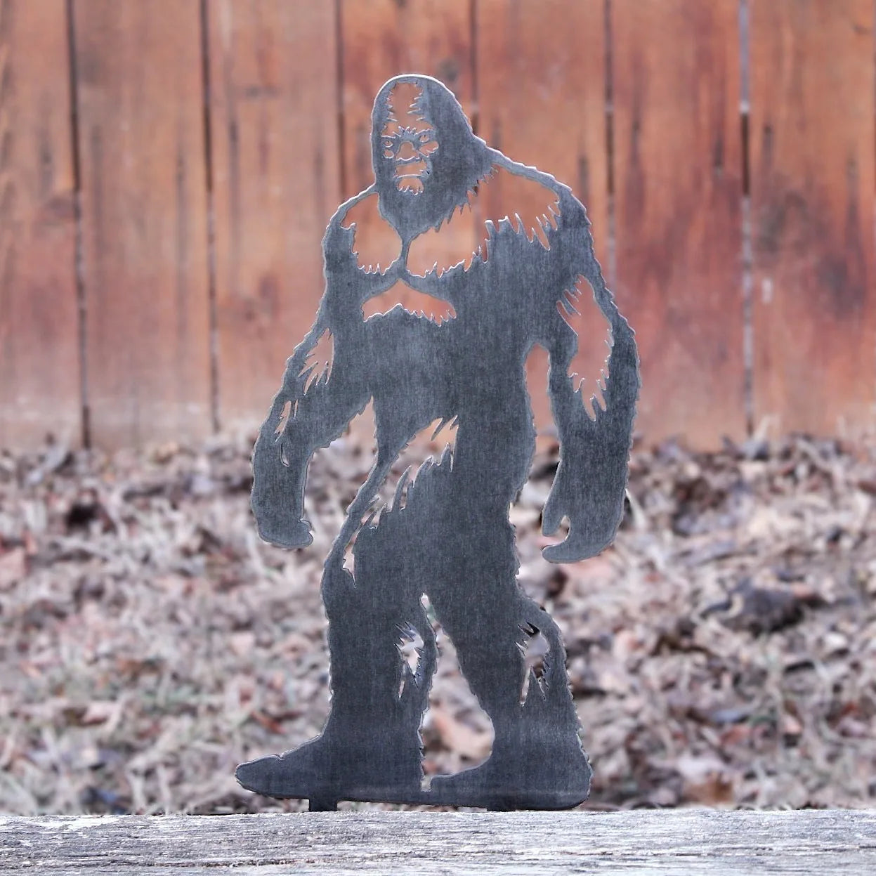 Handmade Sasquatch silhouette in weathered steel, showcasing intricate details for rustic outdoor decor.