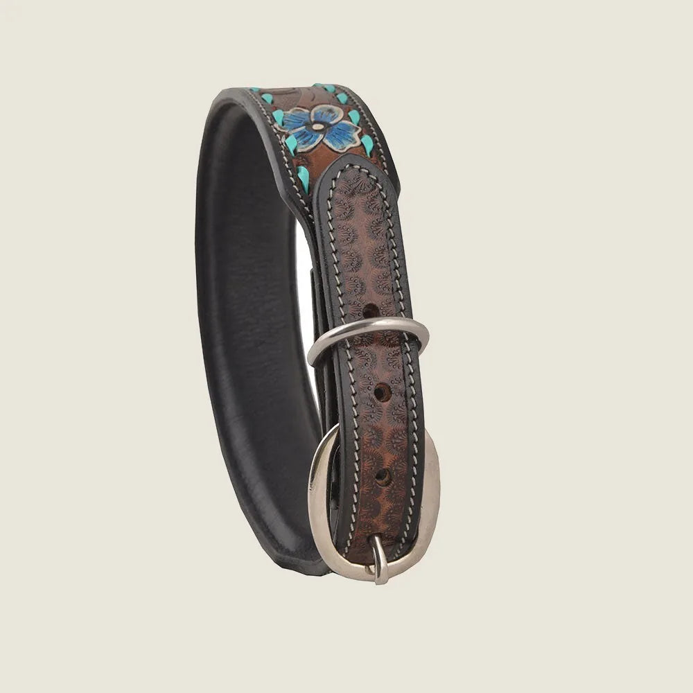 Hand-tooled brown leather dog collar with floral pattern and silver buckle, showcasing durability and natural style.