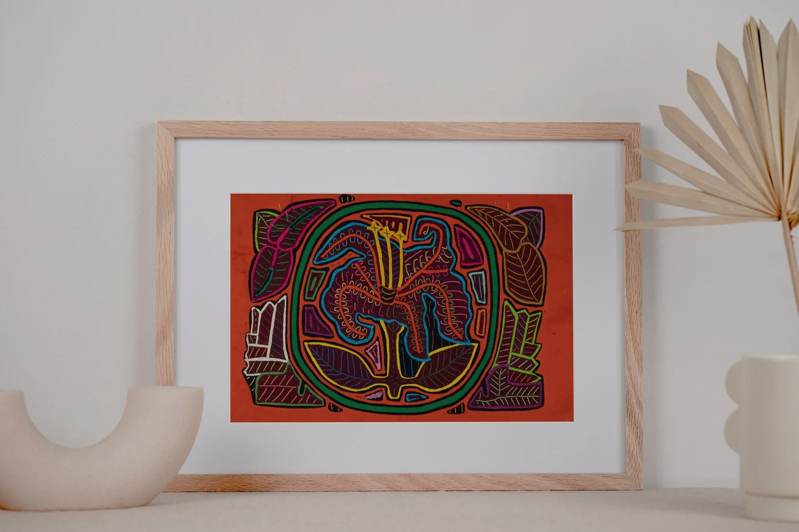 Colorful hand-stitched tapestry of a shaggy puppy and flower, framed with leaves, showcasing Panama's craftsmanship.