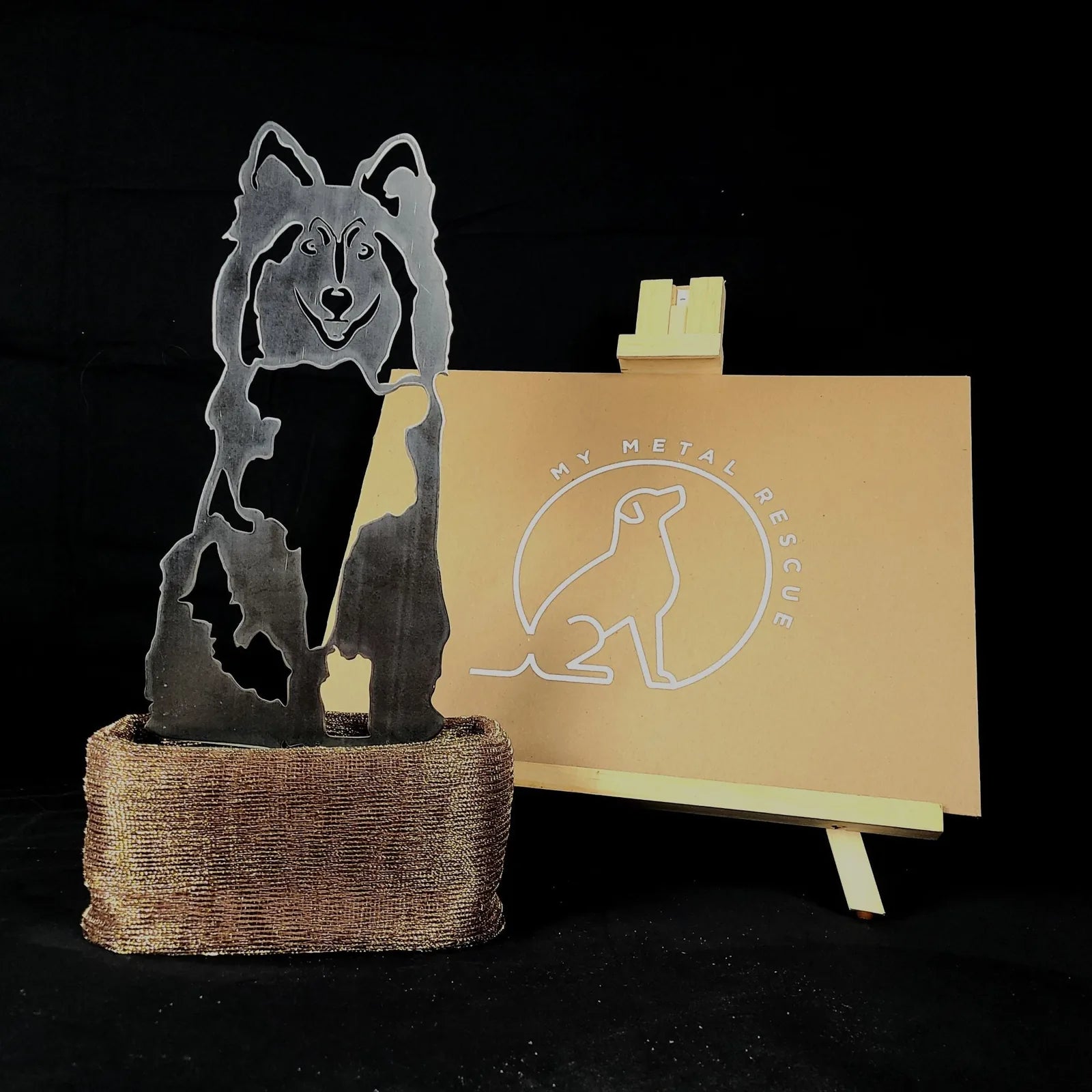 Shetland Sheepdog metal silhouette in Corten steel set in a textured bronze holder, with a My Metal Rescue logo backdrop.