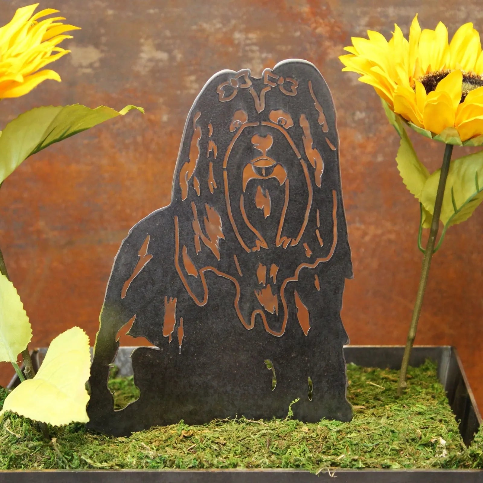 Handmade metal silhouette of a Shih Tzu dog in black, accented by yellow sunflowers and greenery.