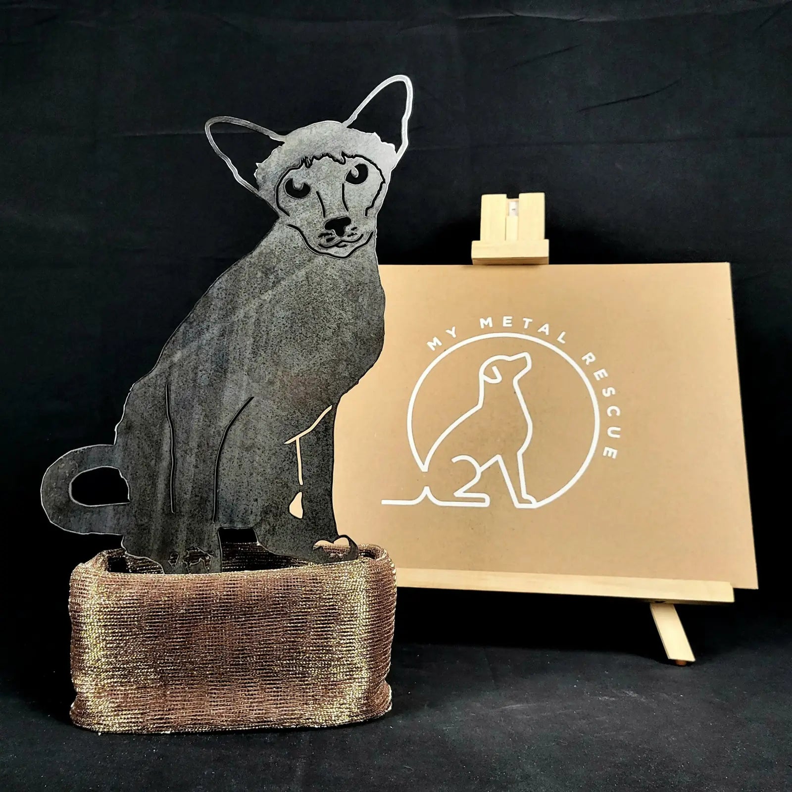 Handmade Siamese cat silhouette in Corten steel, featuring a rustic finish and mounted on a textured base.