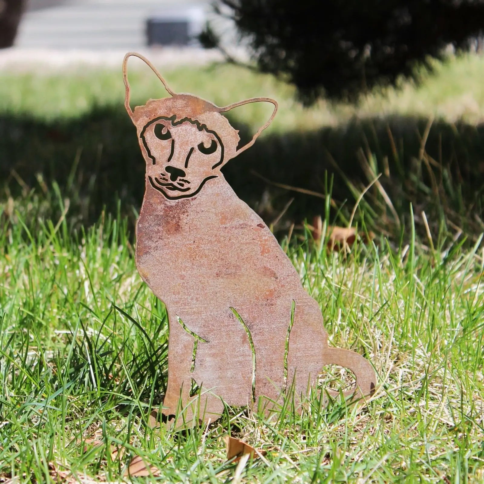 Siamese cat silhouette in rust-colored Corten steel, standing on grass, ideal for garden decor.