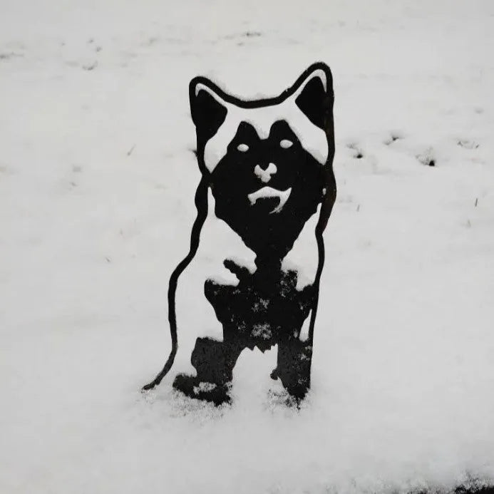Black metal silhouette of a Siberian Husky standing in the snow, showcasing its distinctive features and sturdy design.
