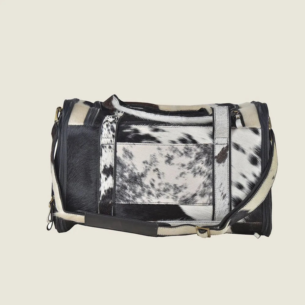Stylish Smoke Hairon Leather Dog Bag in black and white, featuring a soft fur-like texture and durable straps for easy car...