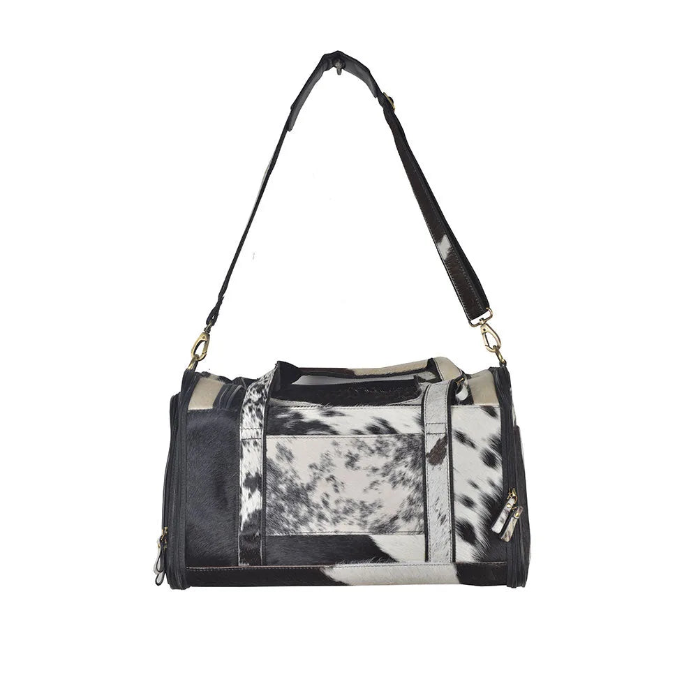 Stylish Smoke Hairon Leather Dog Bag featuring a black and white cowhide pattern, perfect for transporting small dogs comf...