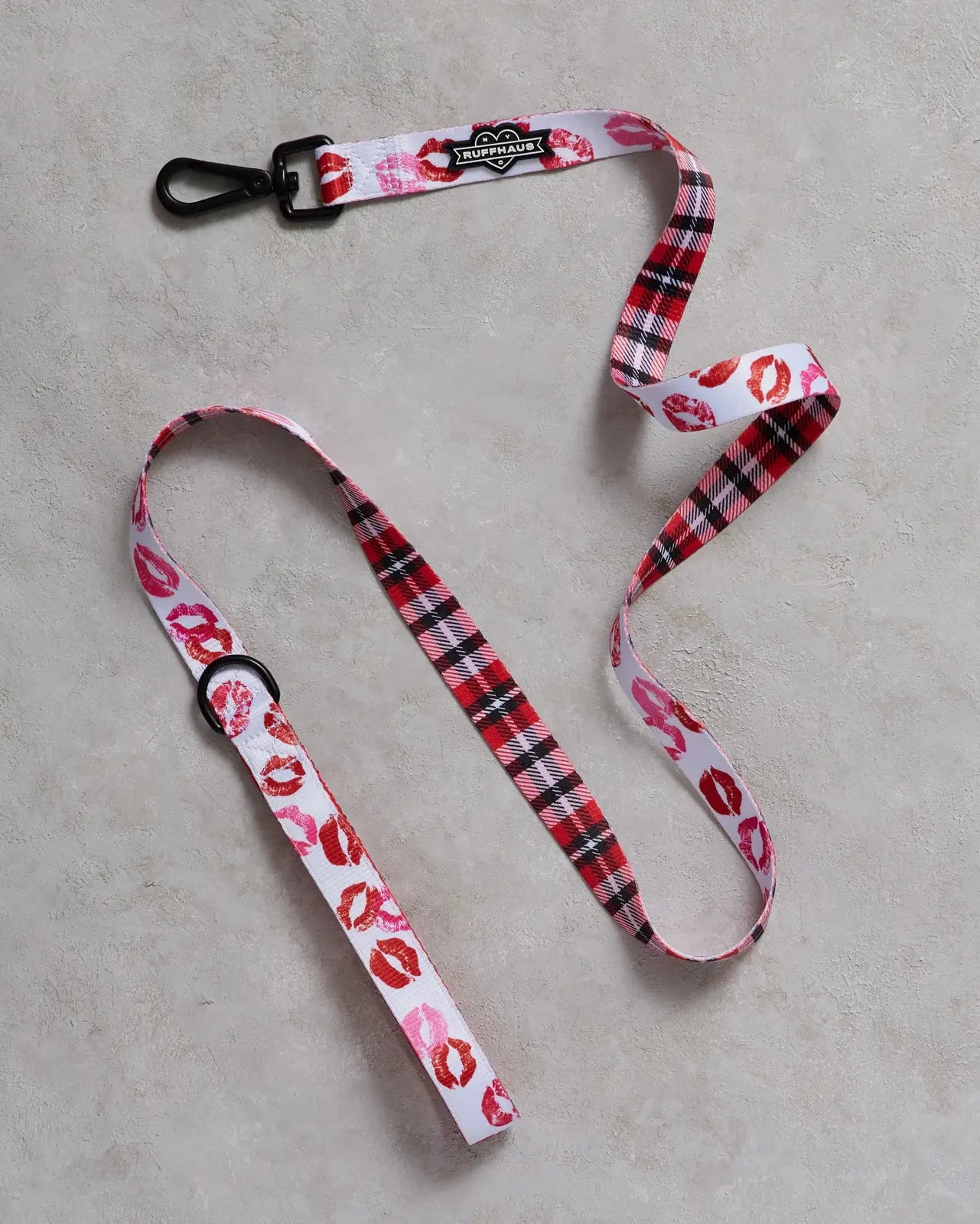 Smooch My Pooch dog leash features a playful kiss print on durable polyester with a red plaid design and a comfortable neo...